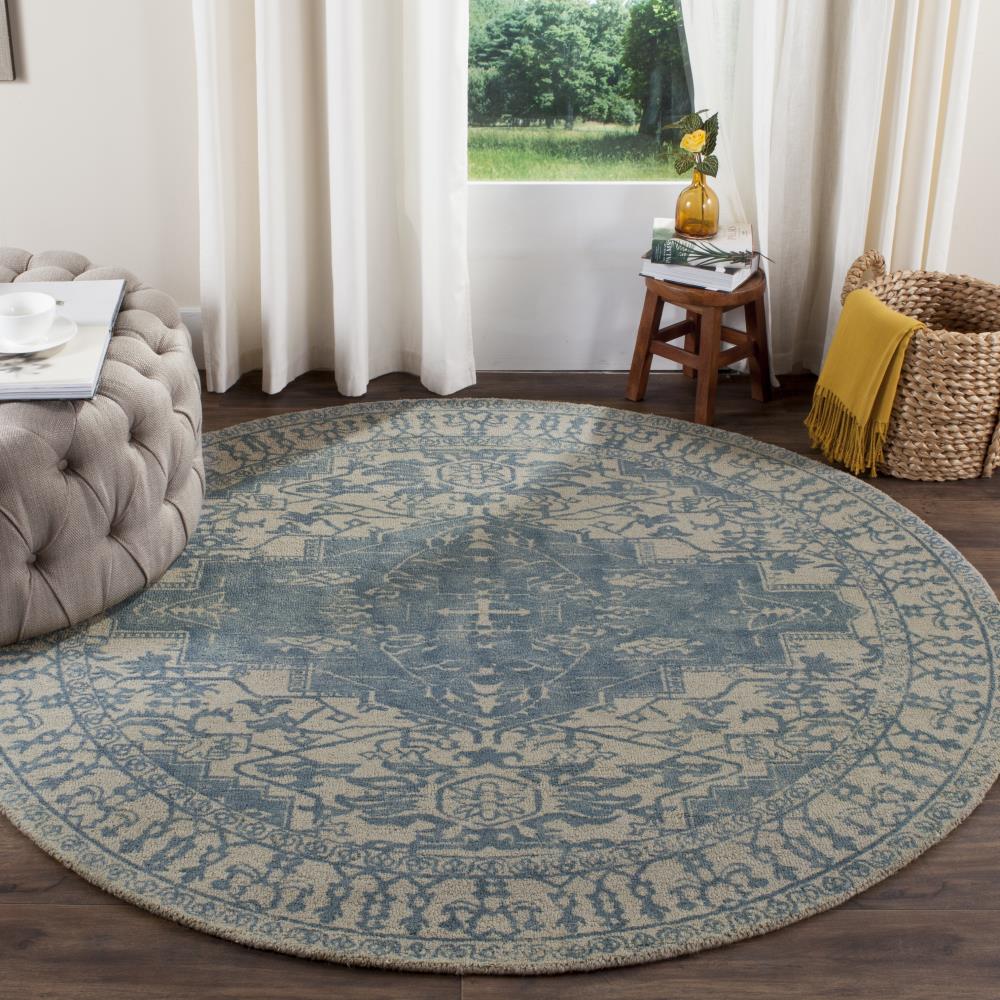 Ivory and Turquoise Round Tufted Wool Area Rug