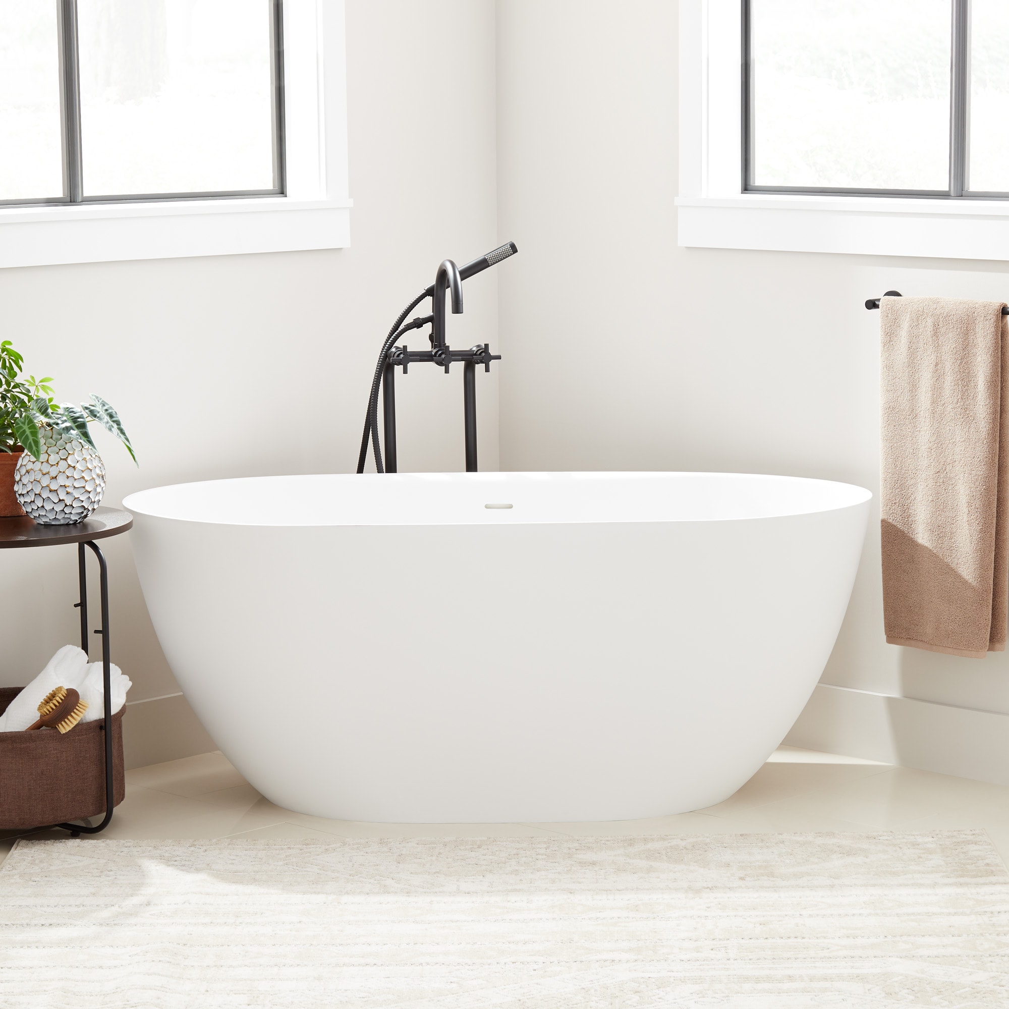Signature Hardware 466610 Catino 32-in x 66-in White Solid surface Oval Freestanding Soaking bathtub with Drain ( Center Drain )