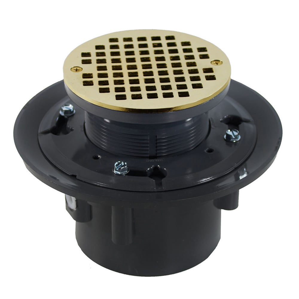 Jones Stephens 4 inch Heavy Duty PVC Floor Drain Base with 3-1/2 inch Plastic Spud, 8-1/2 inch Pan and 6 inch Polished Brass Round Strainer in Gold -  D49239