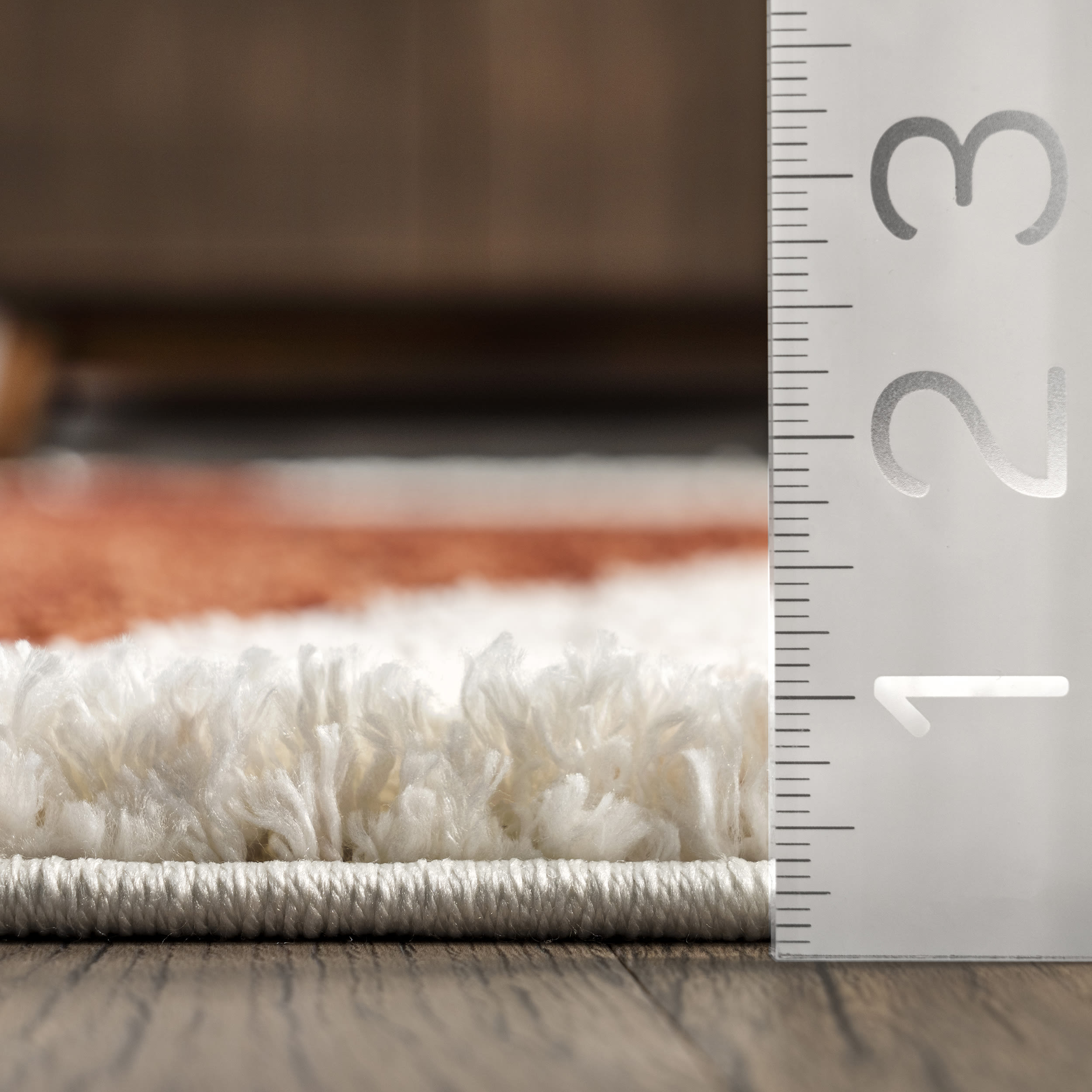 Rust and Ivory Geometric Shag 8' x 10' Synthetic Area Rug