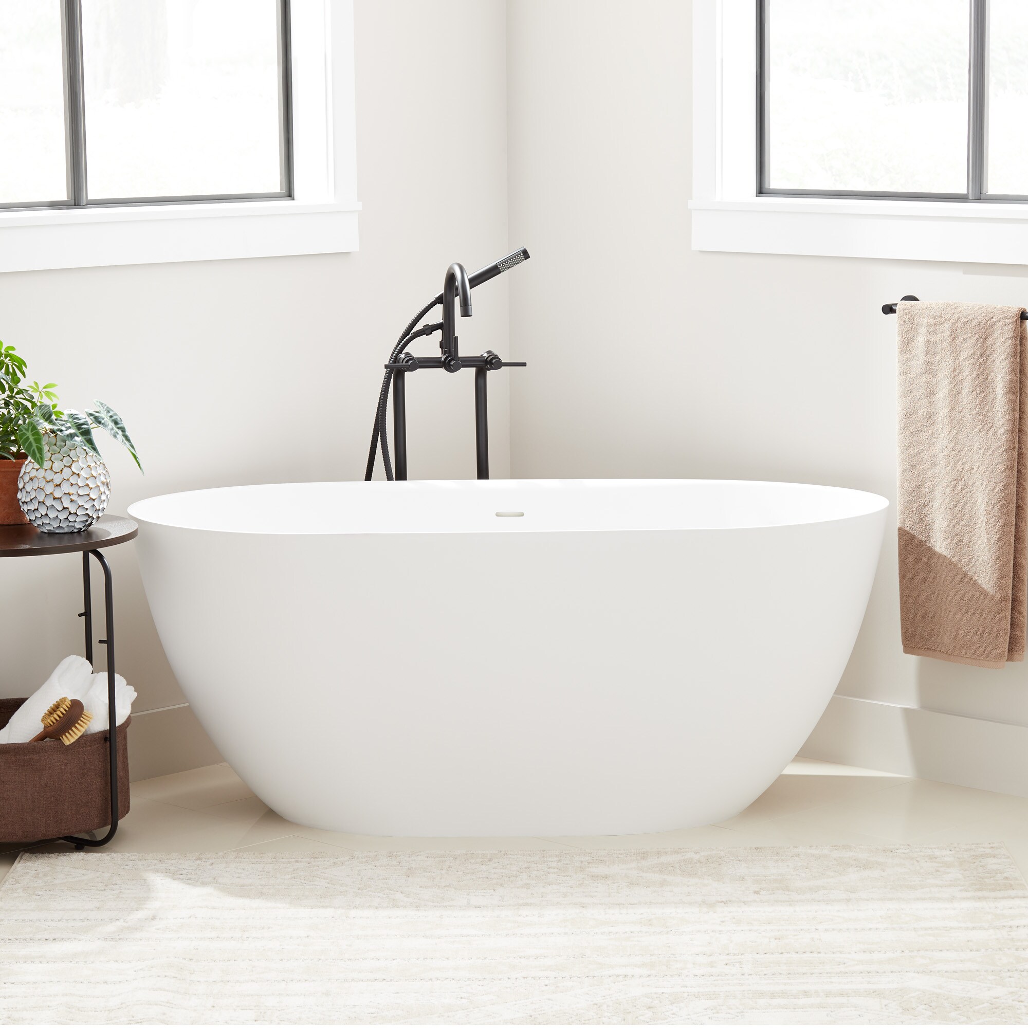 Signature Hardware 466609 Catino 29-in x 59-in White Solid surface Oval Freestanding Soaking bathtub with Drain ( Center Drain )
