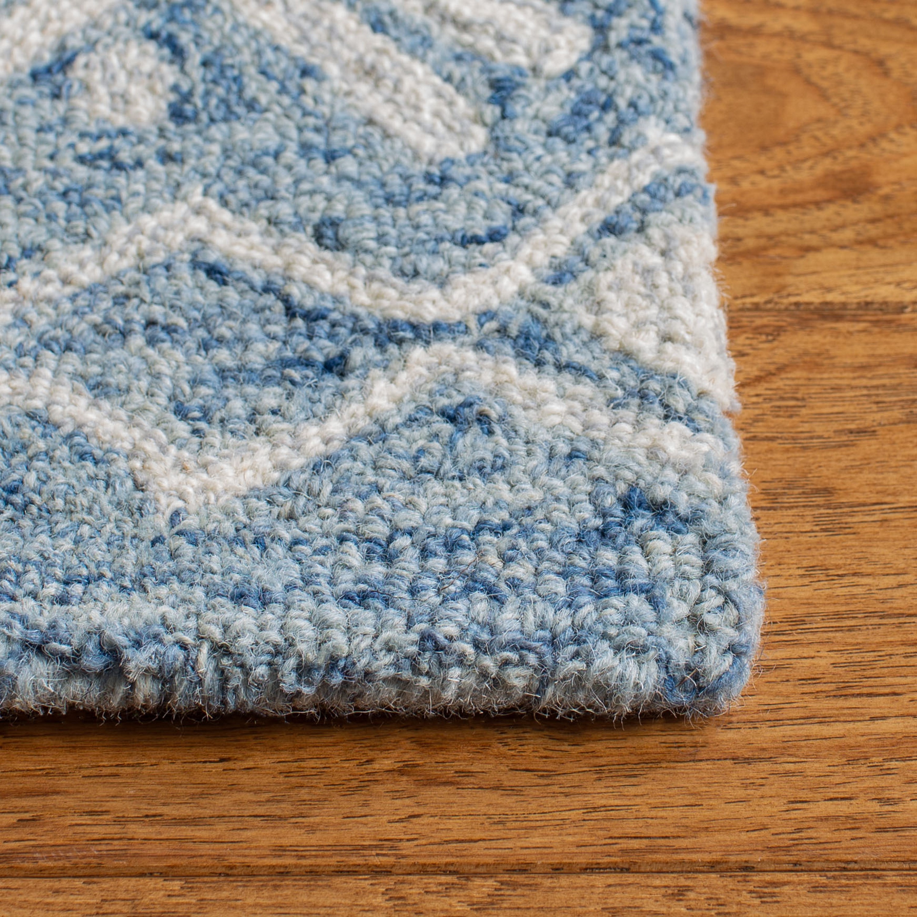 Blue and Ivory Handmade Wool Tufted Area Rug, 5' x 8'
