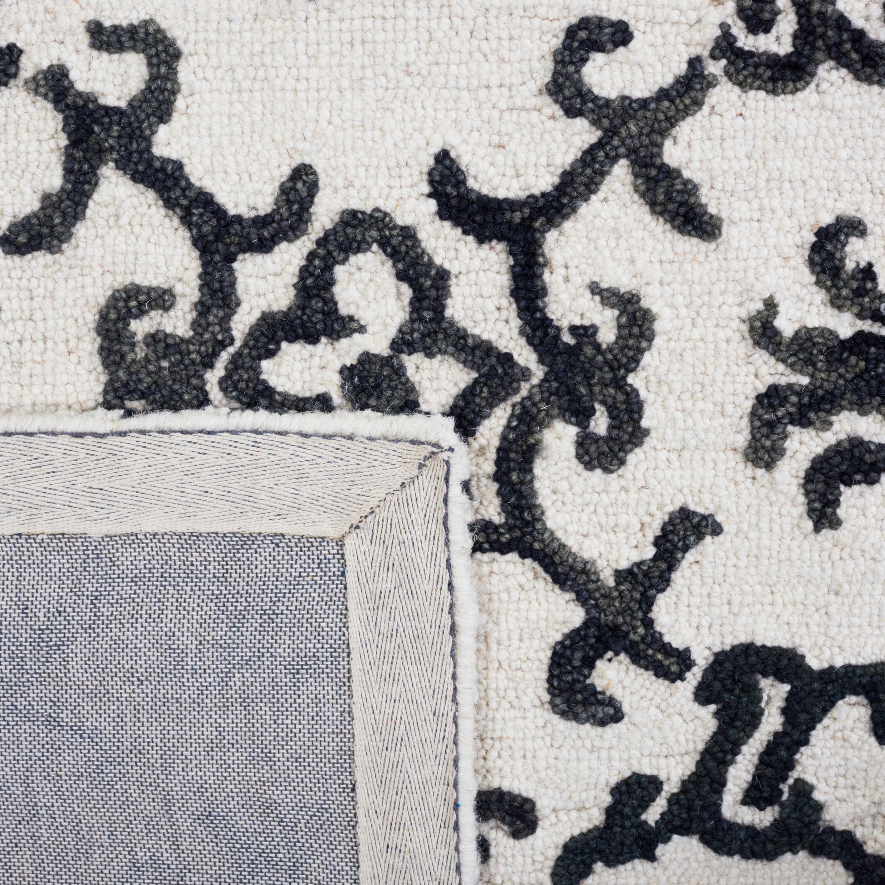 Handmade Black and Ivory Wool Floral 8' x 10' Rug