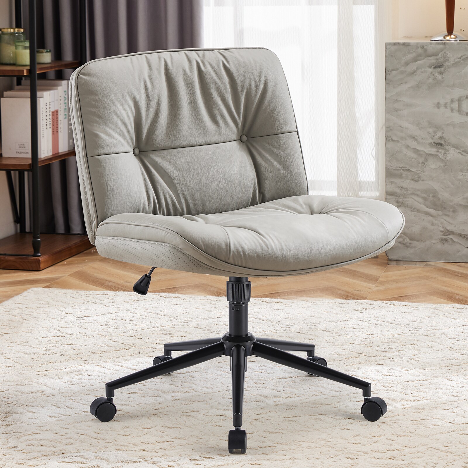 Beige armless swivel chair placed on a rug in a living space