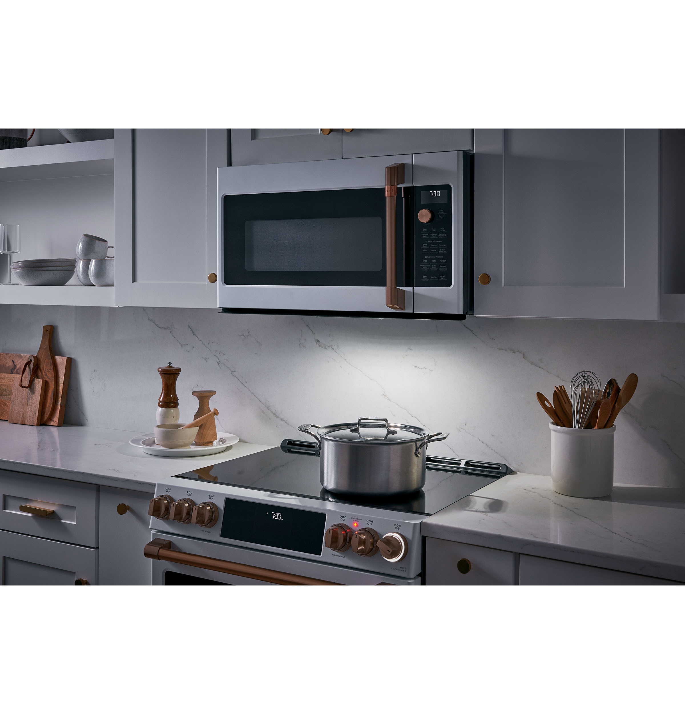 GE Cafe 2.1 Cu. Ft. Over The Range Microwave Oven in Stainless Steel with  Brushed Stainless Handles