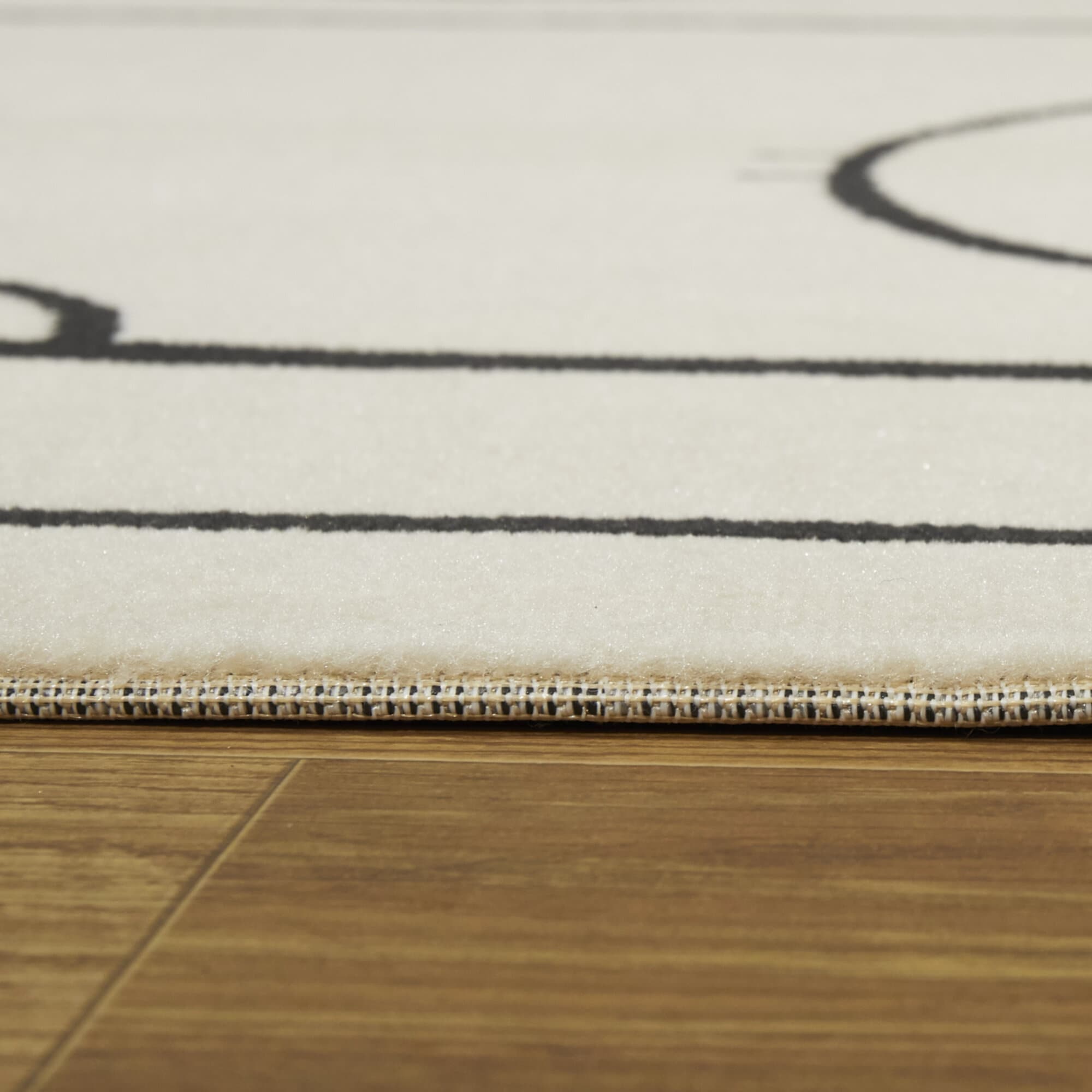 4' x 6' Black and Cream Synthetic Hockey Rink Kids' Rug