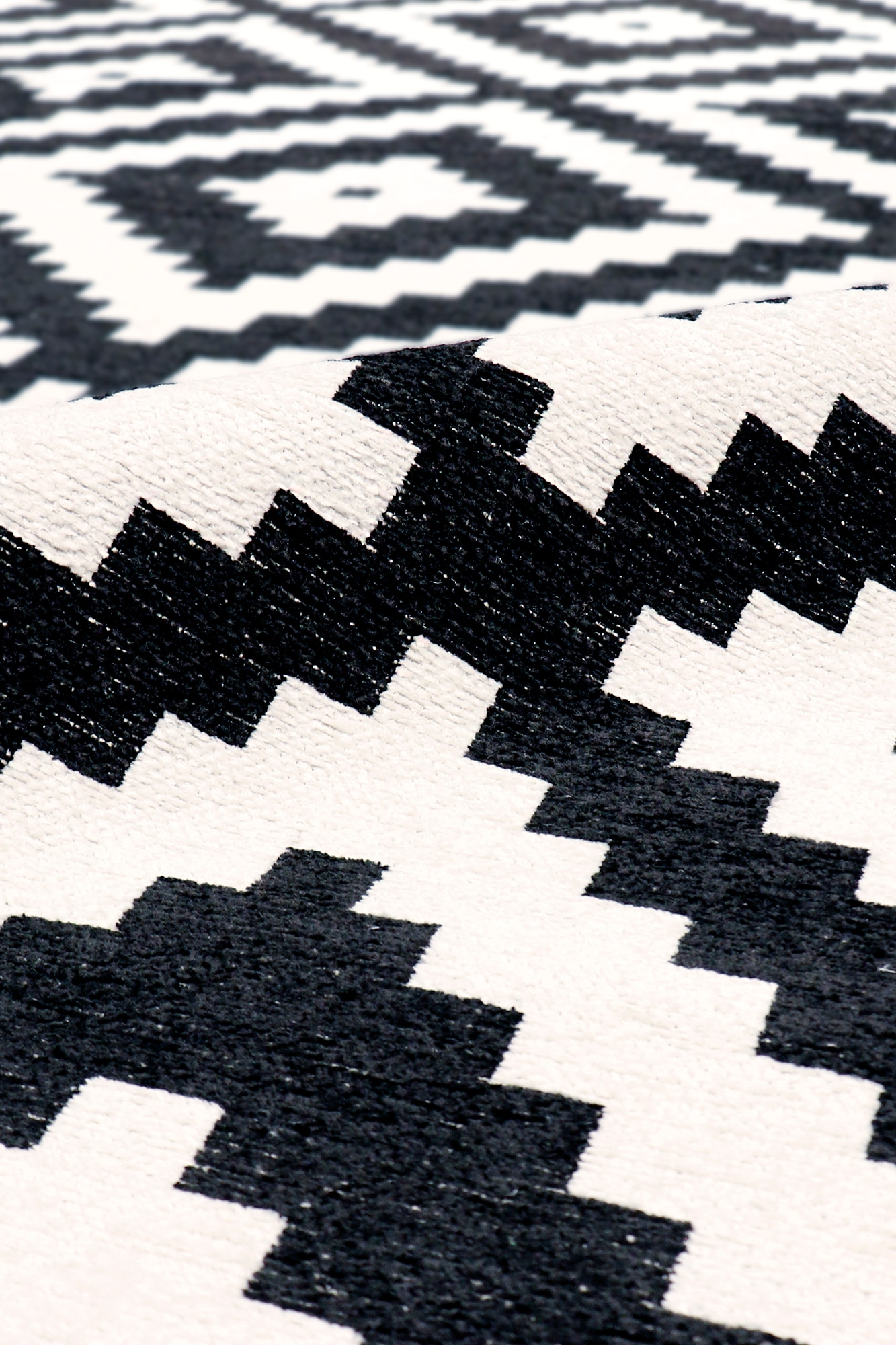 Handmade Reversible Geometric Black Chenille Rug 59" x 31"