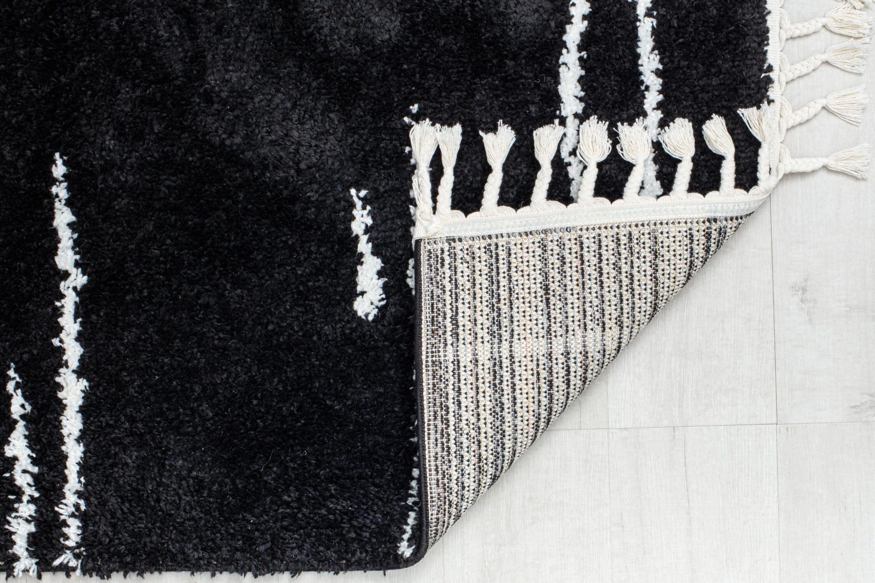 Introspective Black Abstract Shag Synthetic Area Rug with Braided Tassels