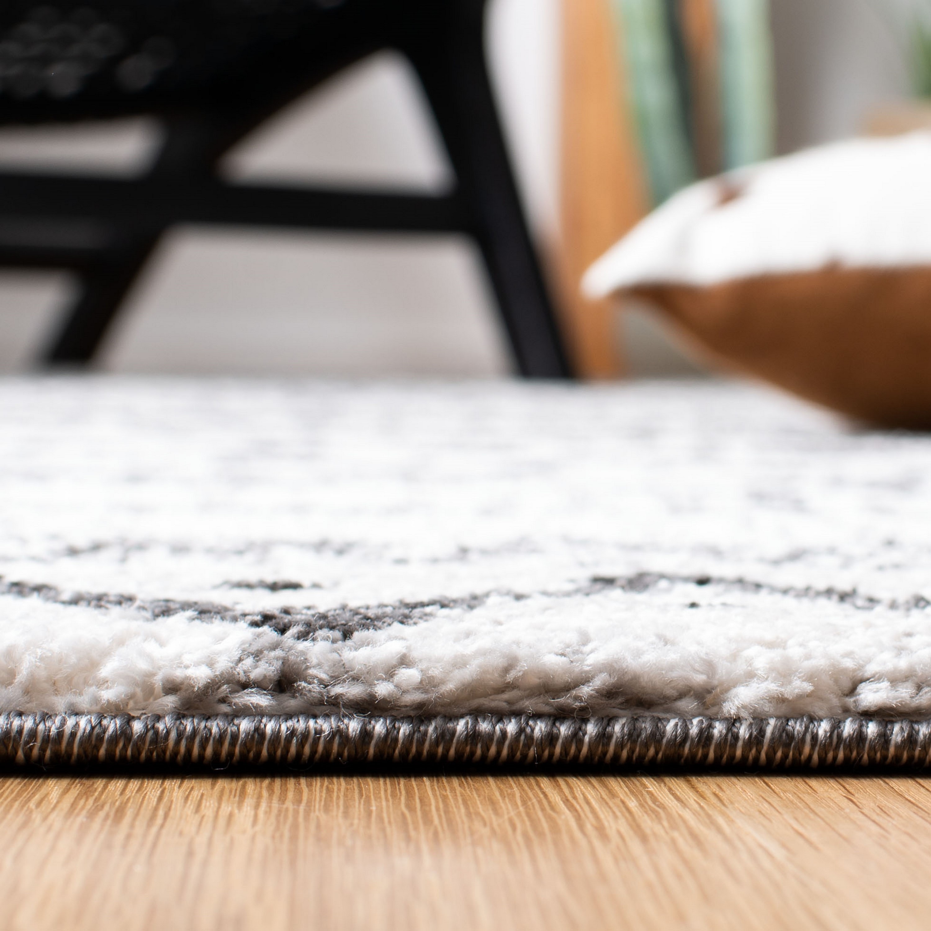 8' x 10' Black and Ivory Geometric Synthetic Area Rug