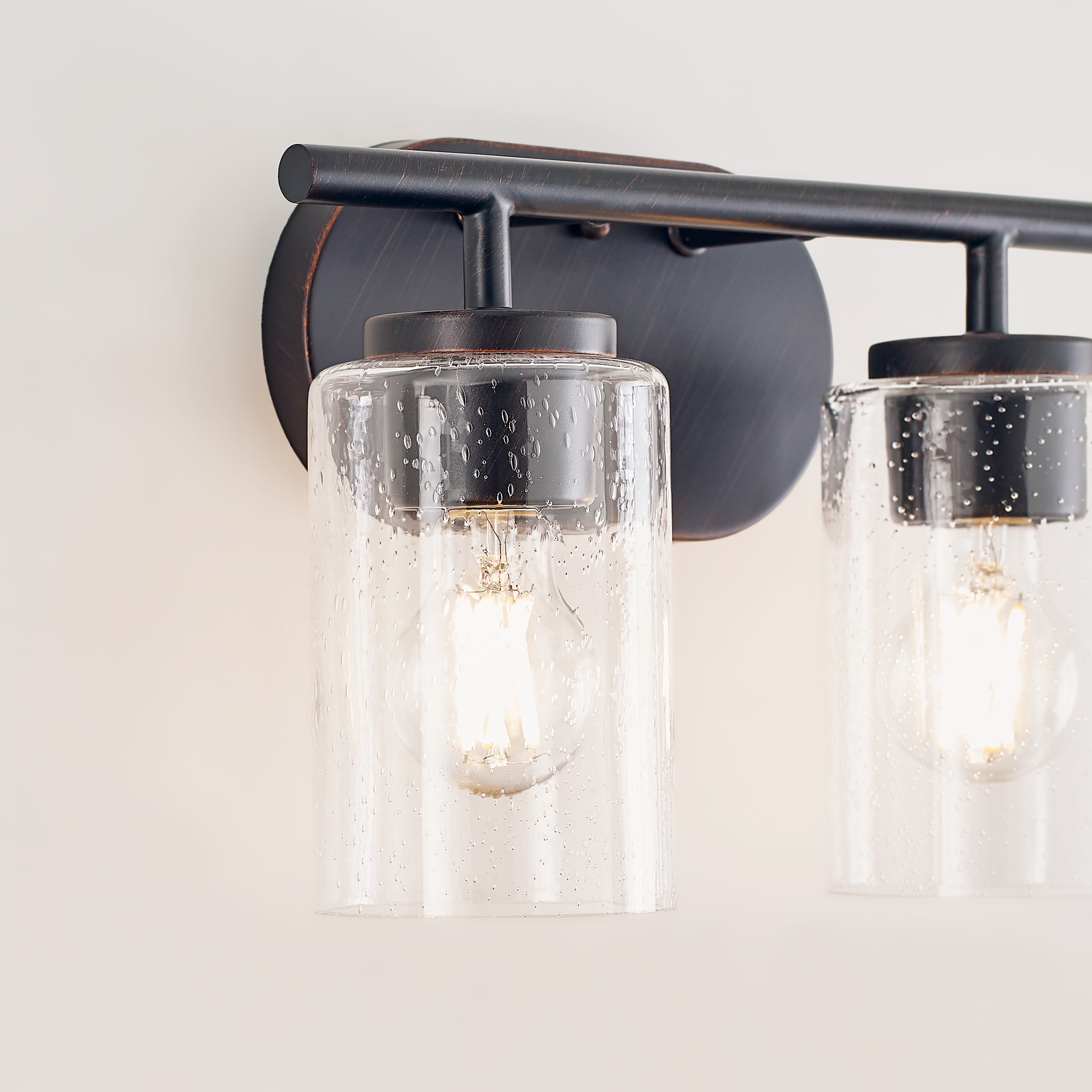 Oslo Bronze 2-Light Vanity Fixture with Clear Seeded Glass