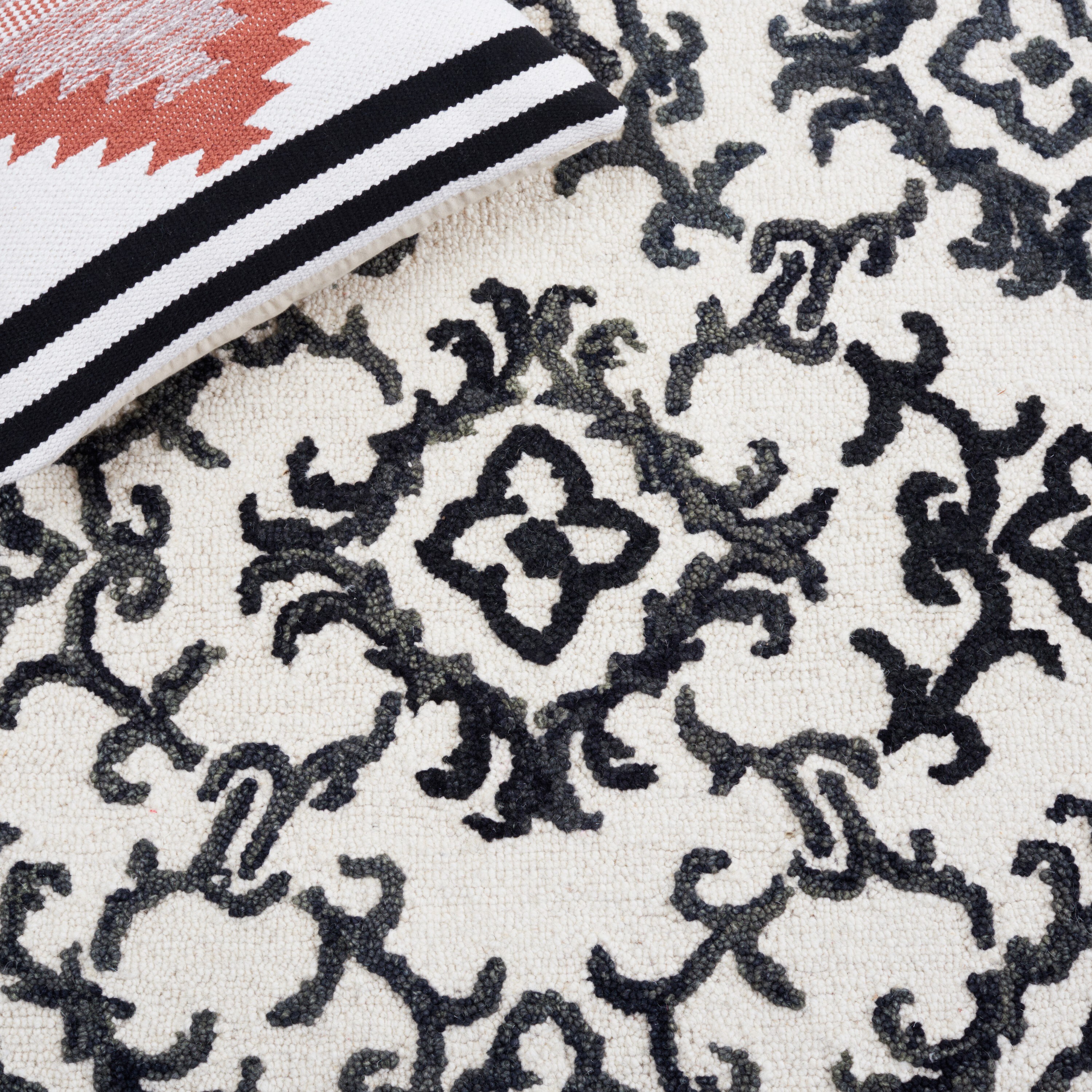 Handmade Black and Ivory Wool Floral 8' x 10' Rug