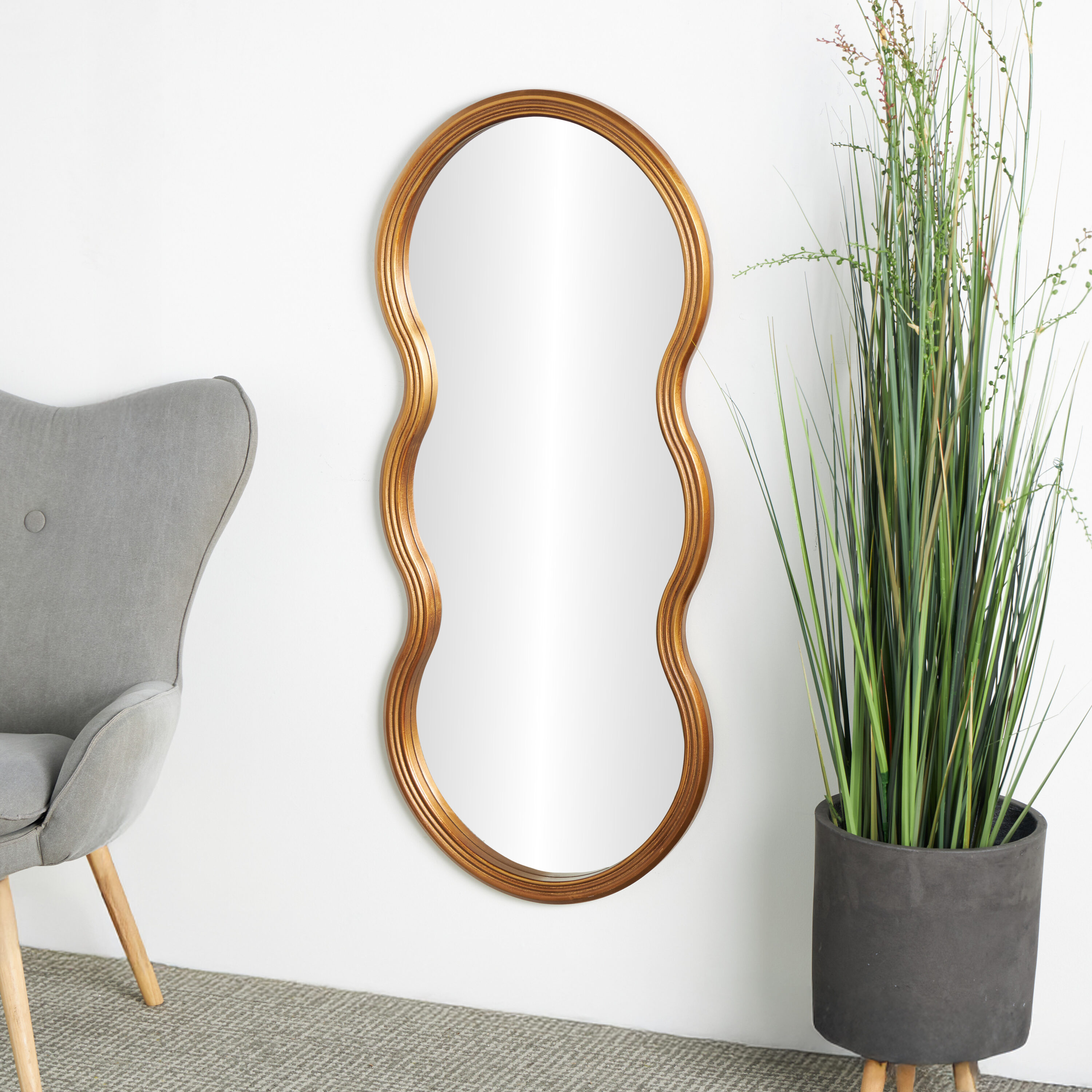 Grayson Lane 821707 20.3-in W x 47.0-in H Irregular Gold Wavy Framed Wall Mirror