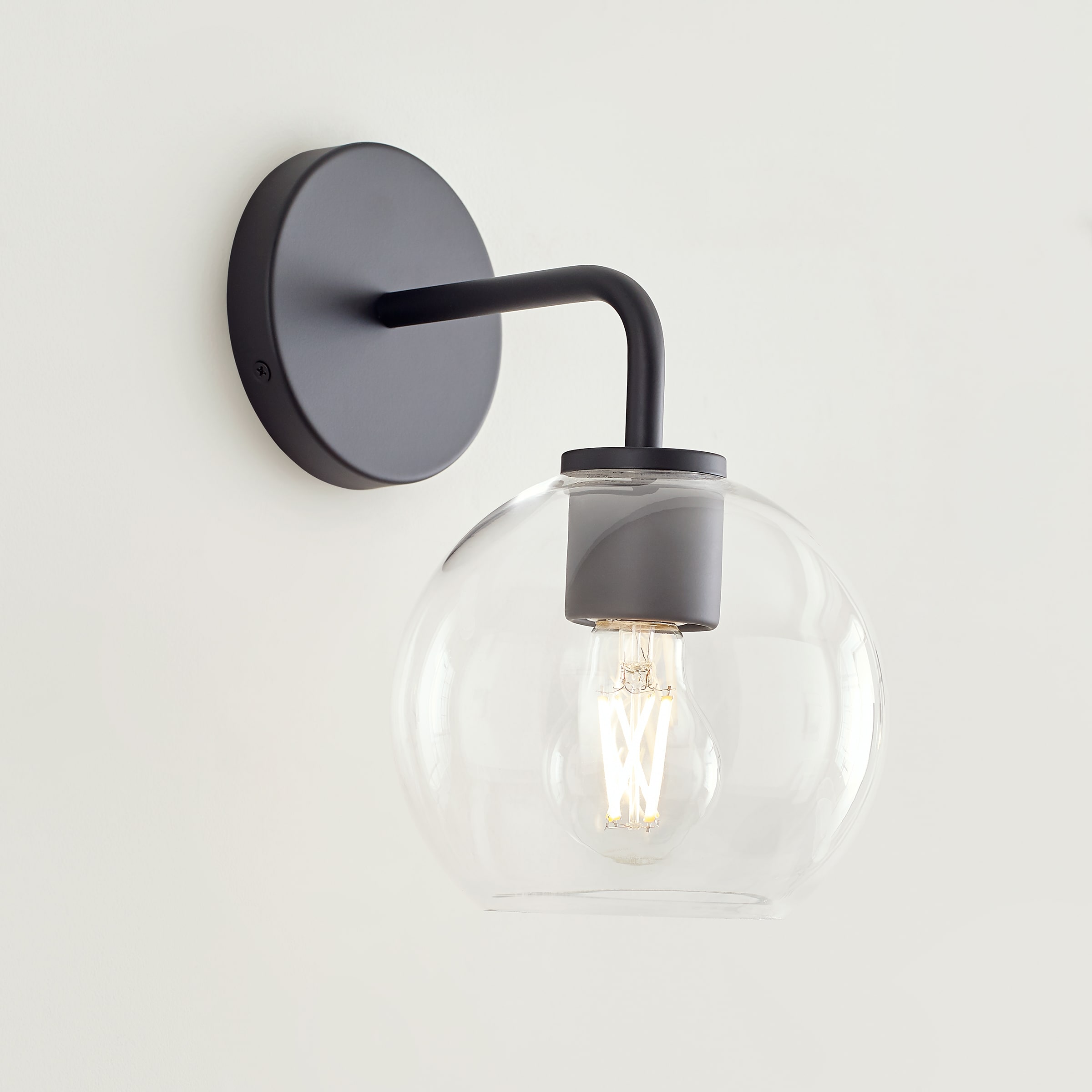 Orley Matte Black Geometric Wall Vanity with Clear Glass Shade