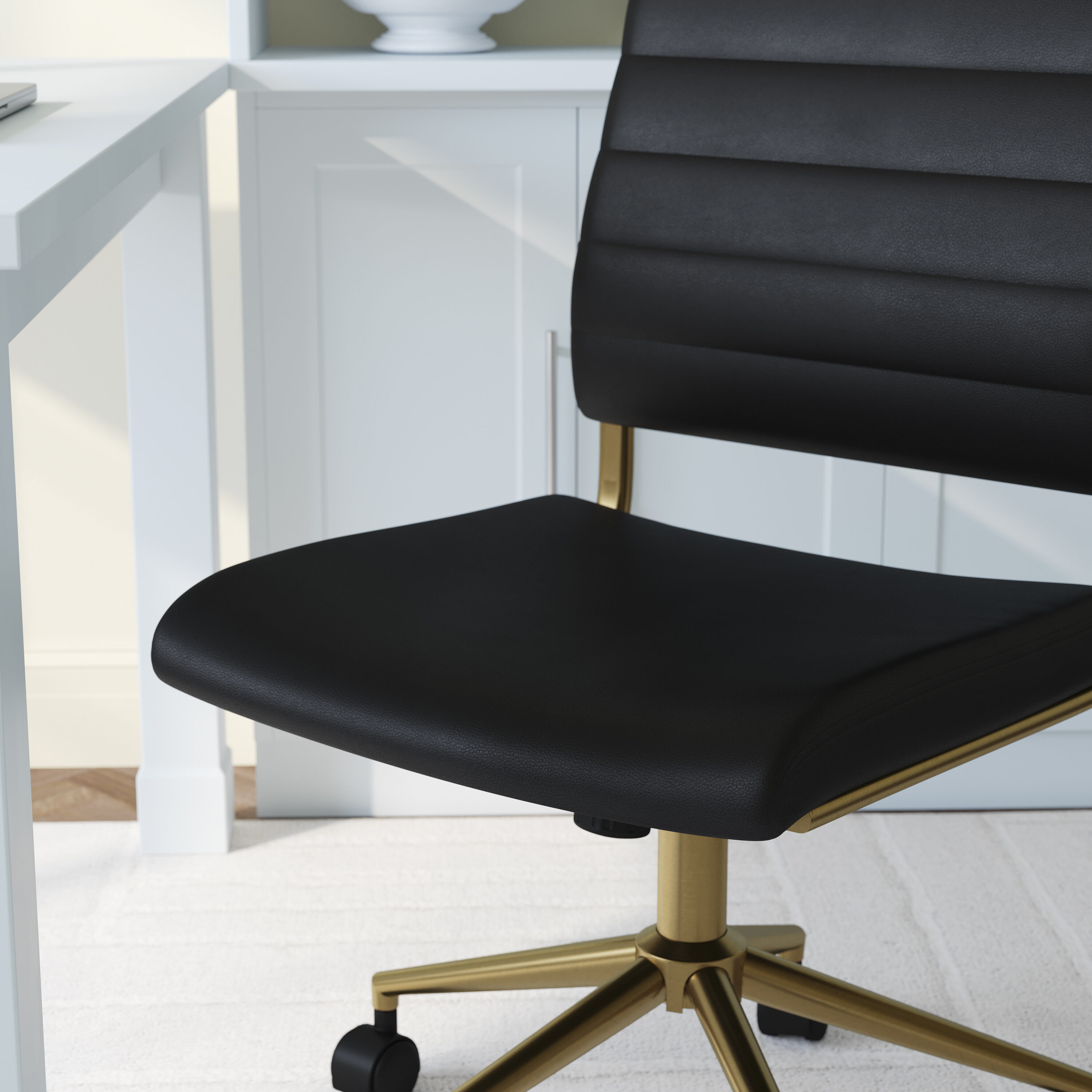 Black Faux Leather Armless Swivel Office Chair with Brass Frame