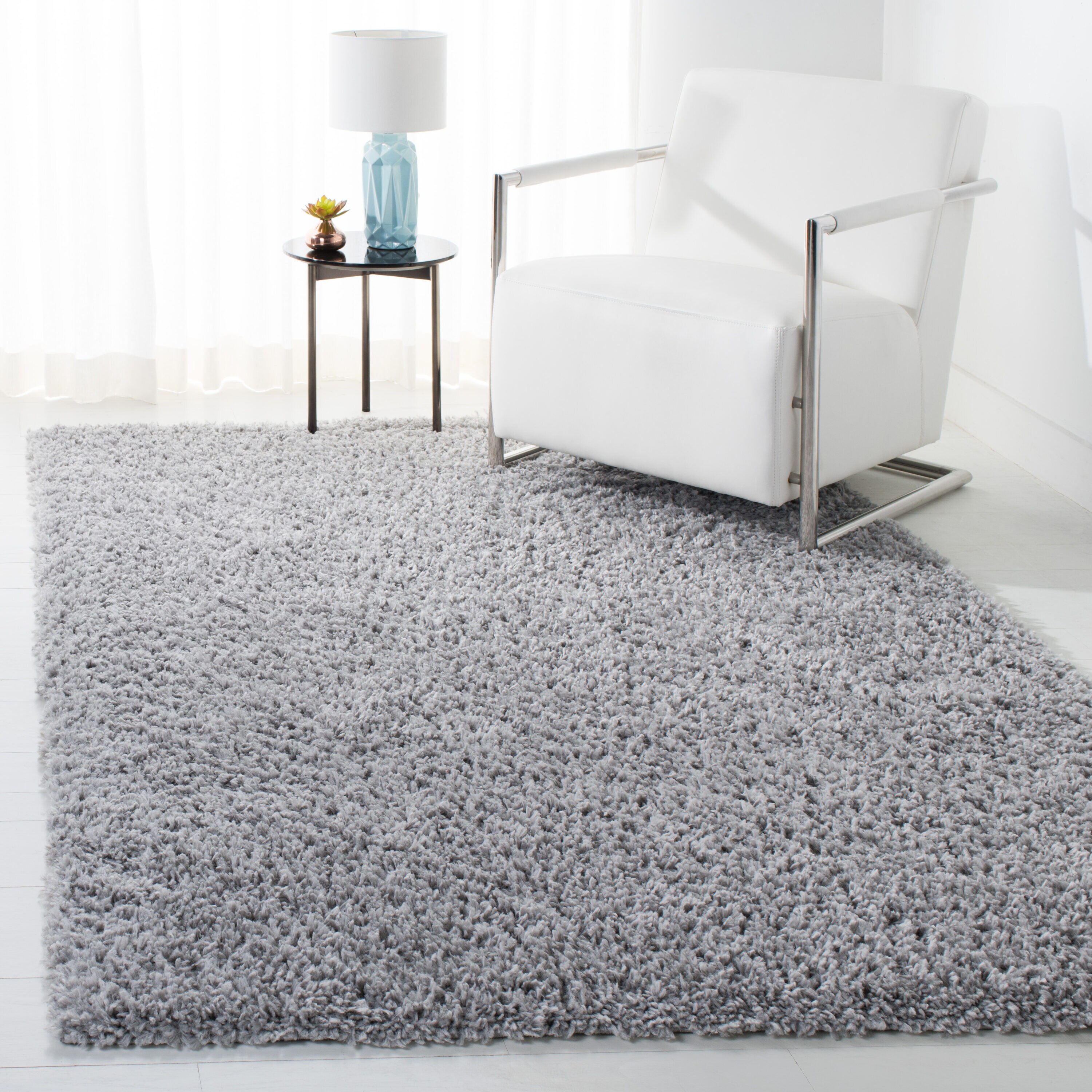 August Shag 5 x 8 (ft) Loomed Polypropylene Silver Rectangular Indoor Solid Spot Clean Only Area rug
