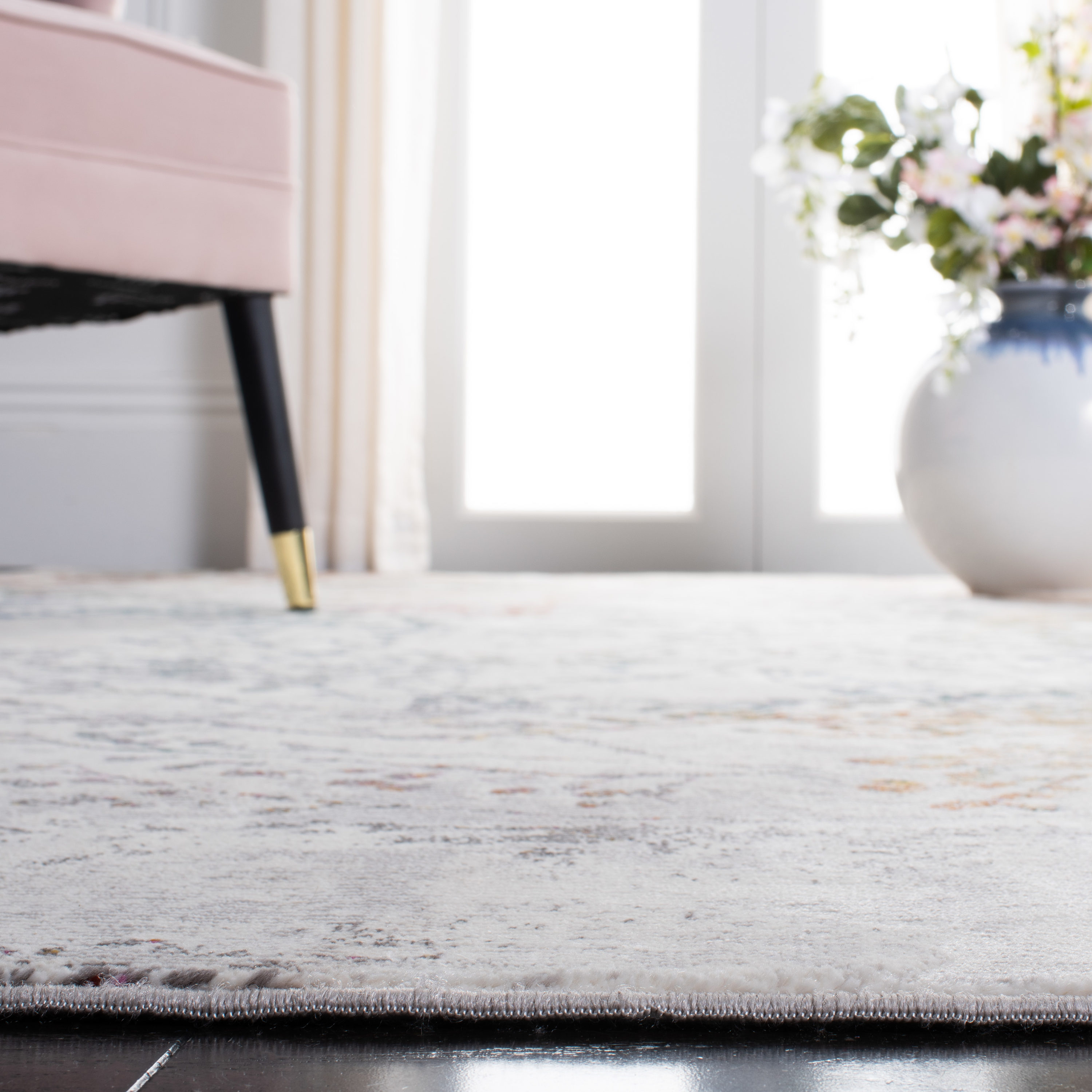 Ivory and Multicolor Synthetic Rectangular 9' x 12' Area Rug