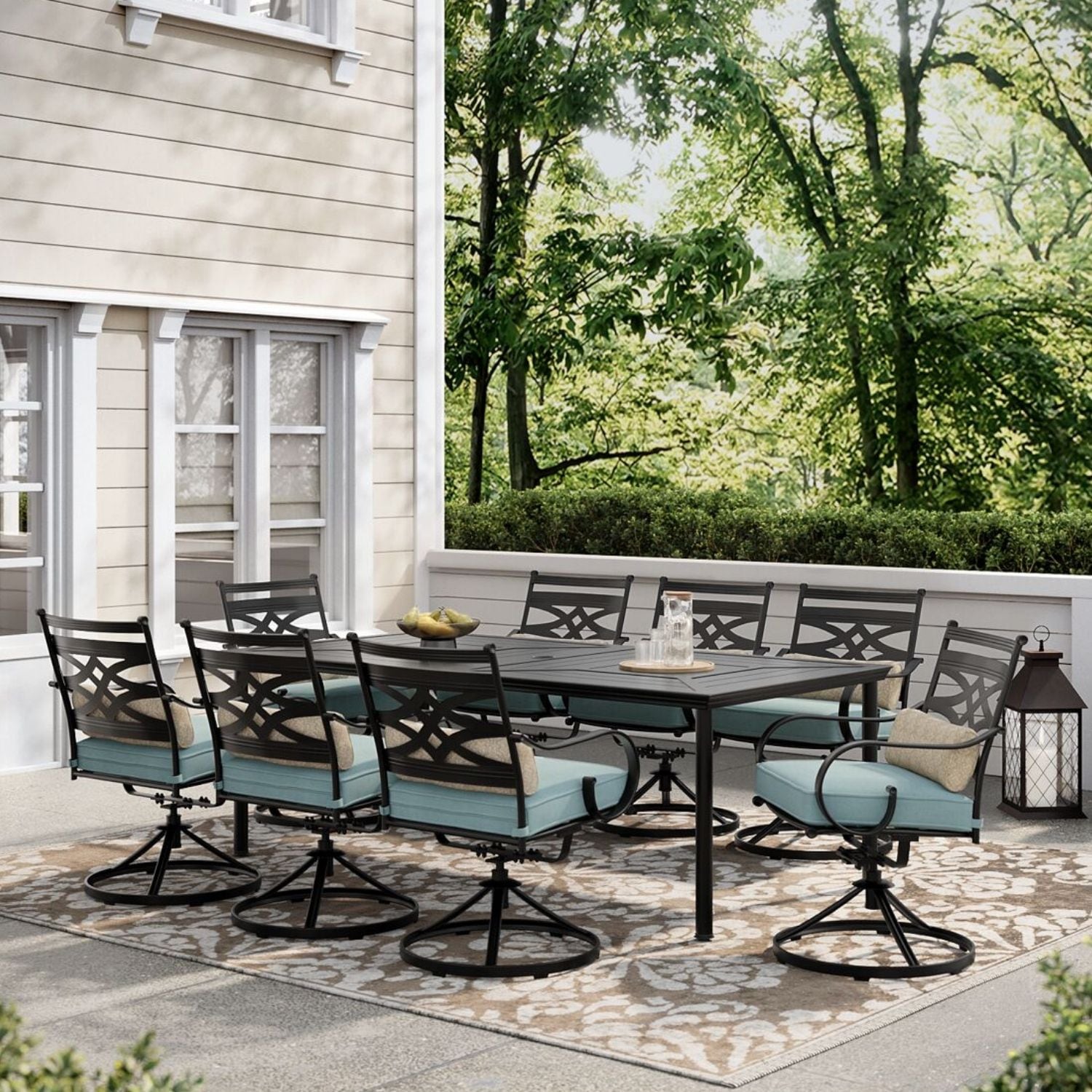 Hanover Montclair 9 Piece Dining Set in Ocean Blue with 8 Swivel Rockers and A 42 In. x 84 in. Table
