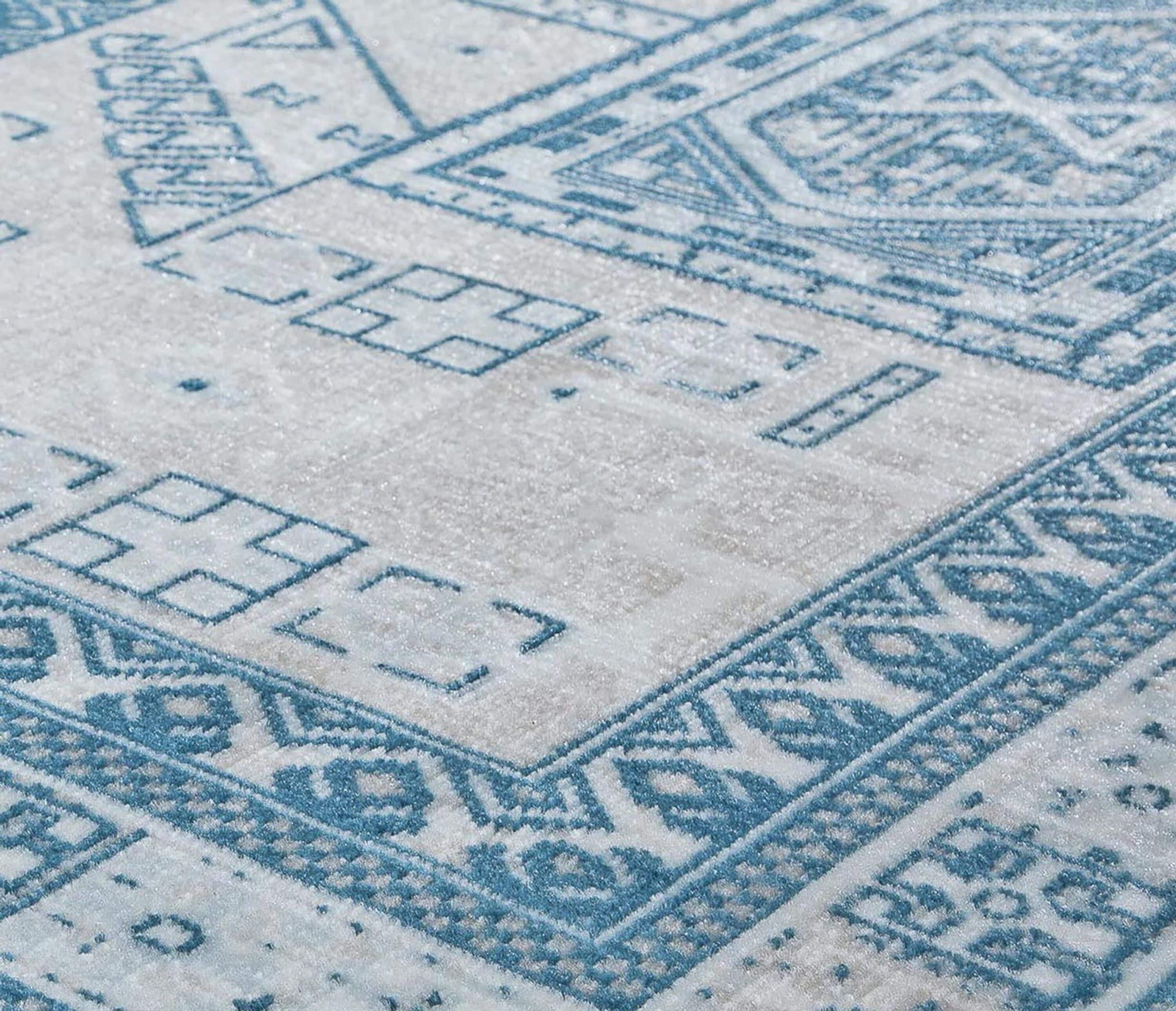 Azure Elegance 5' x 7' Reversible Blue Synthetic Area Rug