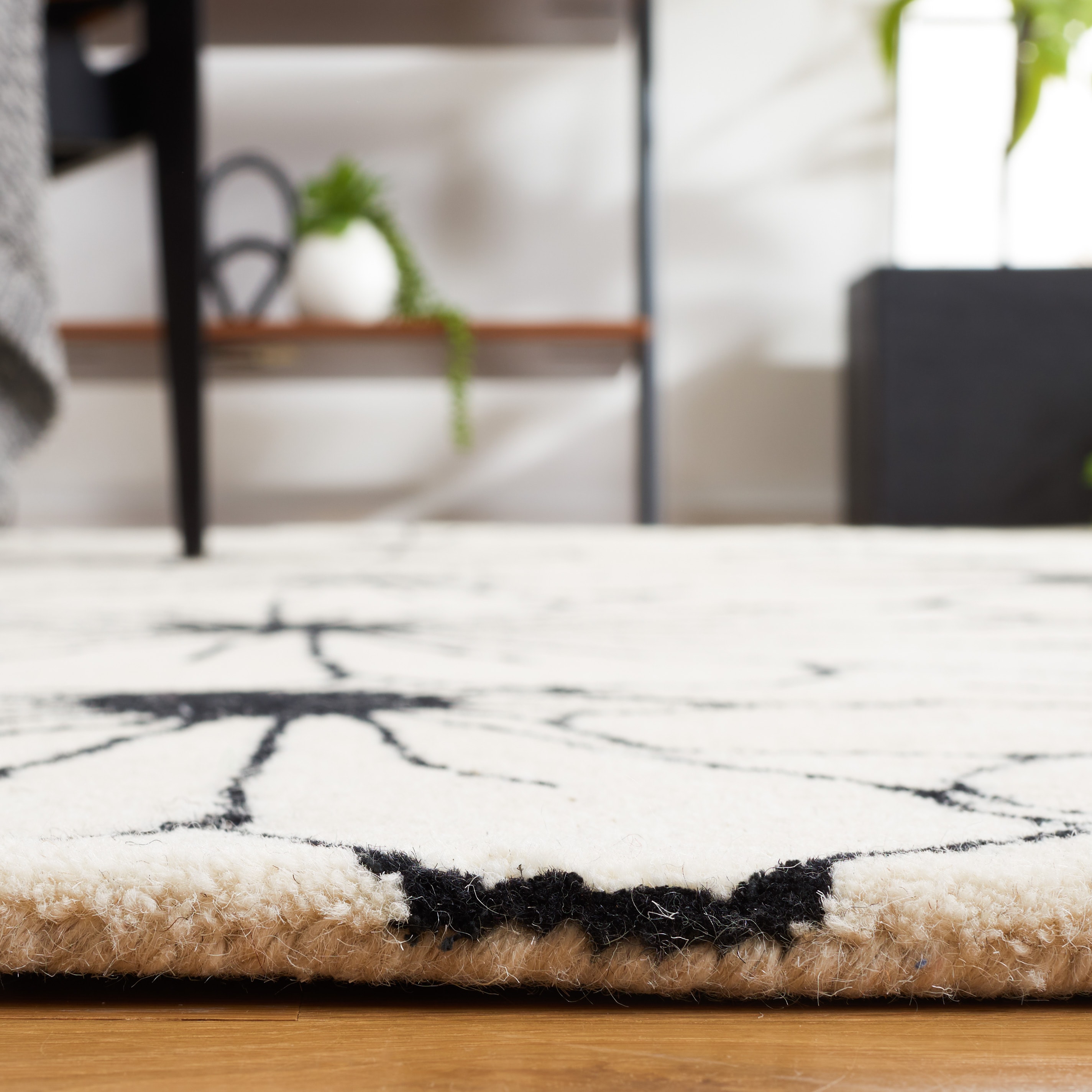Ivory Handmade Round Tufted Wool and Viscose Rug, 2' x 3'
