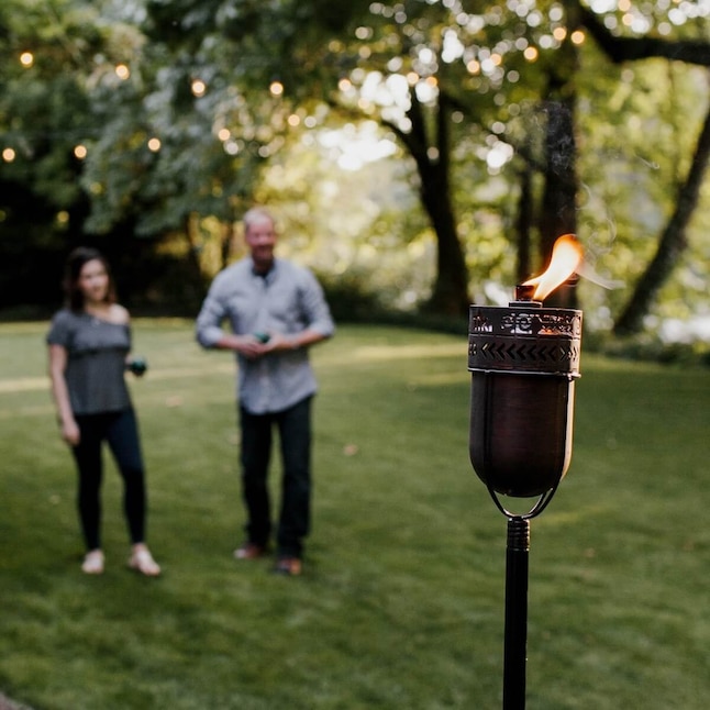 TIKI Fire Island 65-in Copper Citronella Garden Torch in the Garden