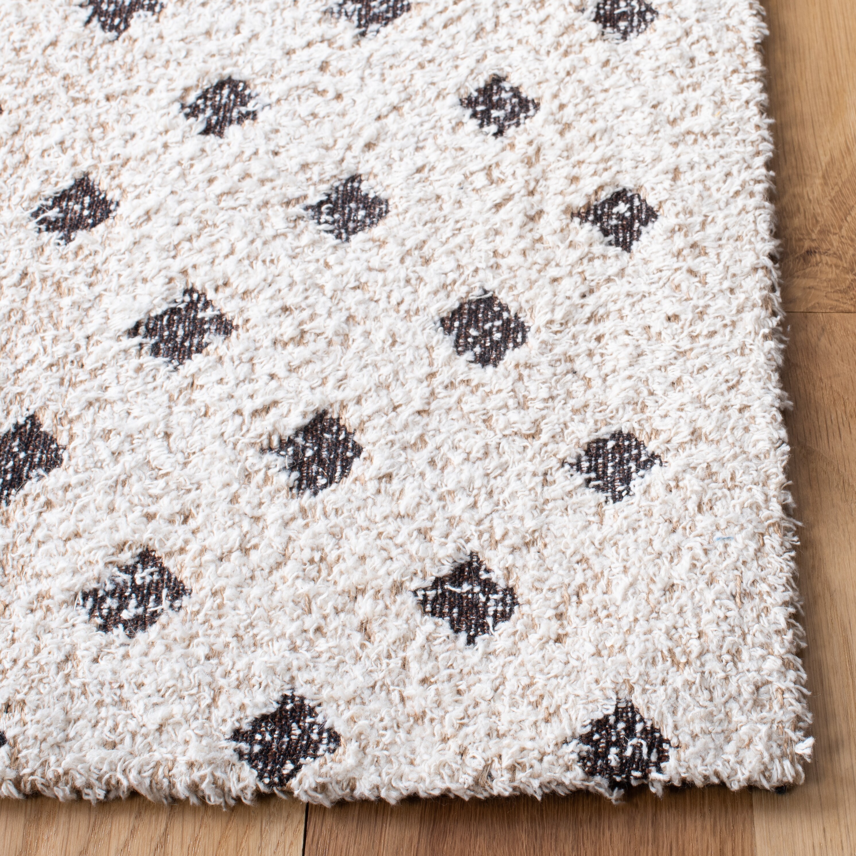 Ivory and Natural 3' x 5' Hand Woven Synthetic Area Rug