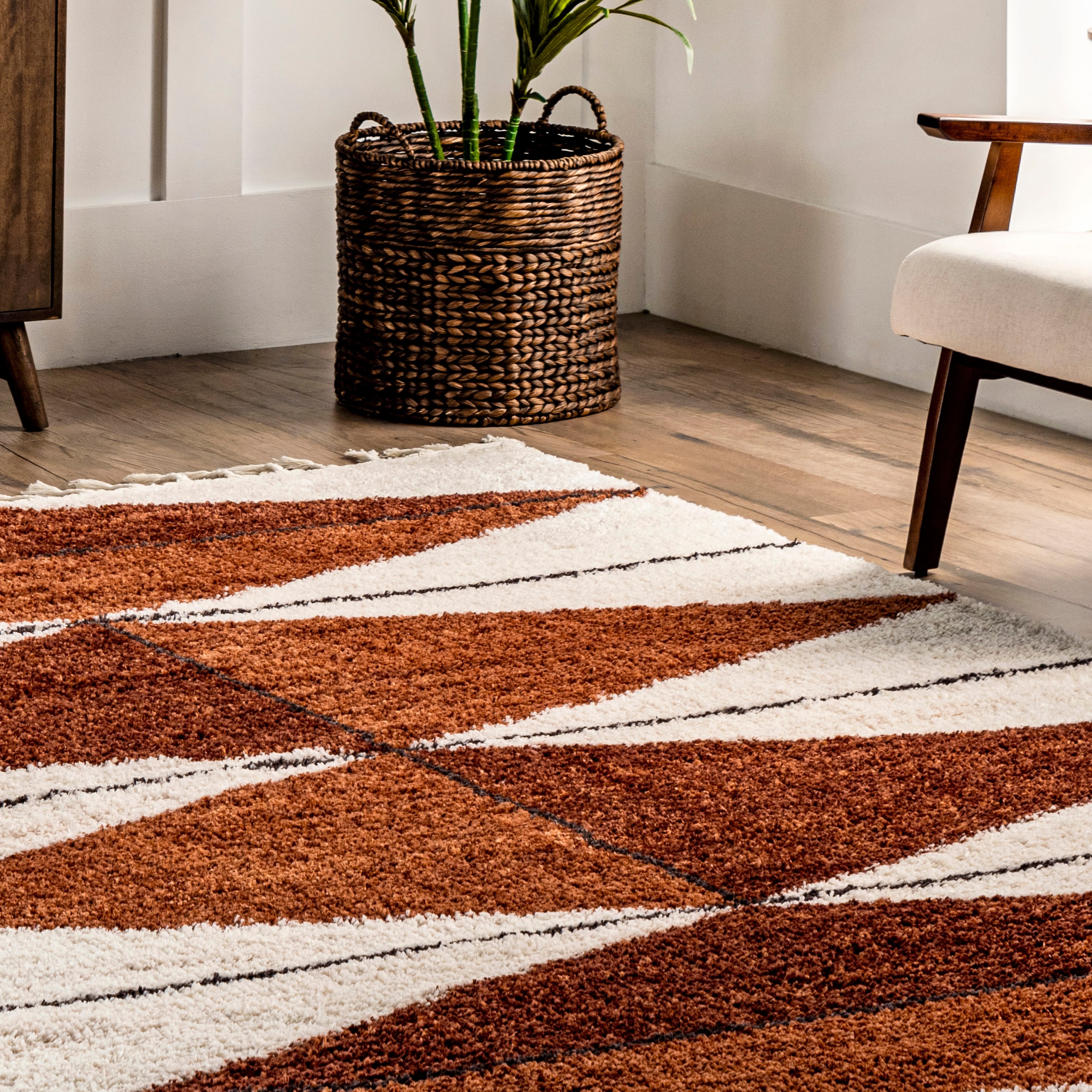 Rust and Ivory Geometric Shag 8' x 10' Synthetic Area Rug