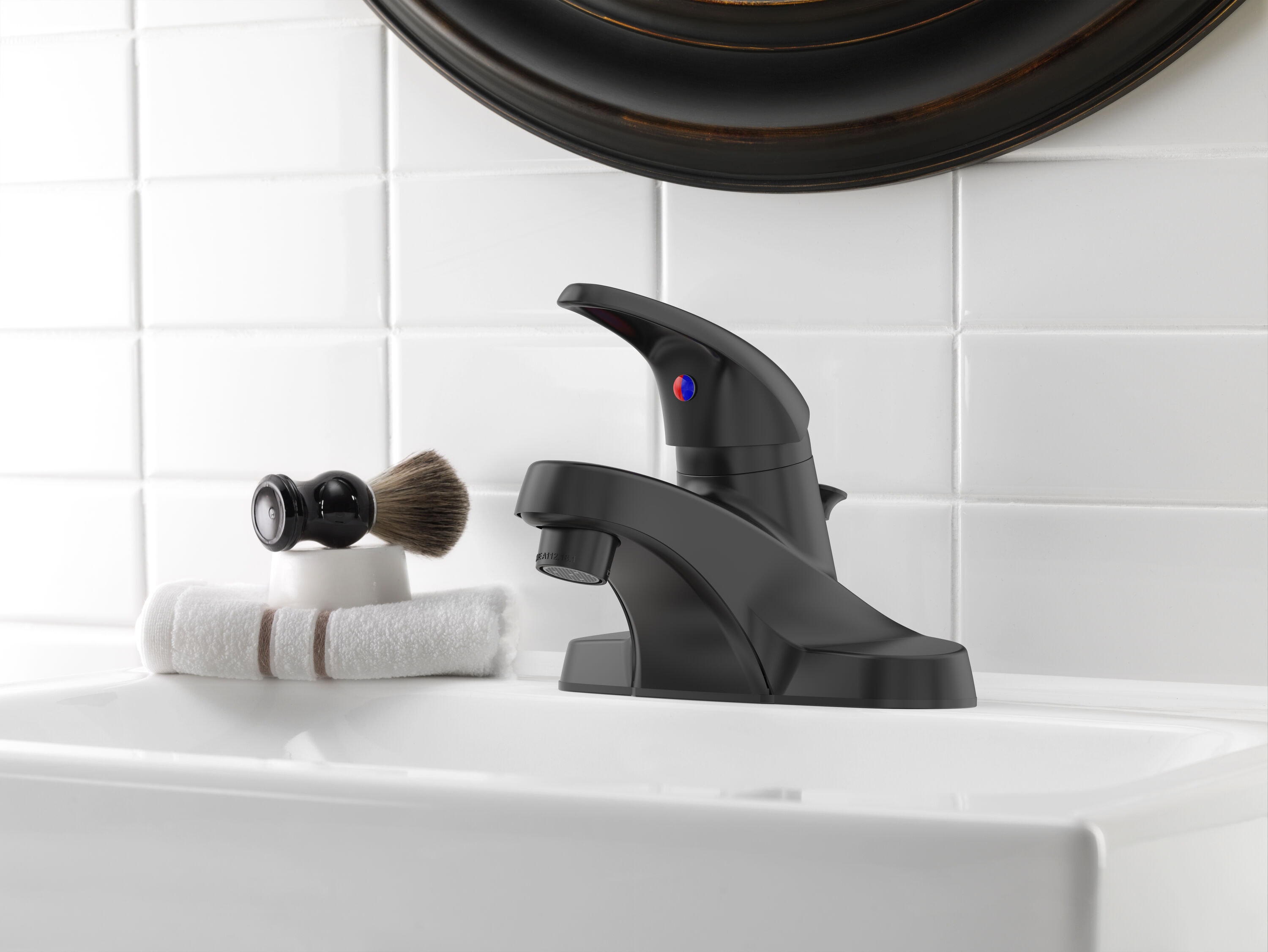 Project Source 67100W-627001 Matte Black 4-in centerset 1-handle WaterSense Low-arc Residential Handle Bathroom Sink Faucet with Drain with Deck Plate