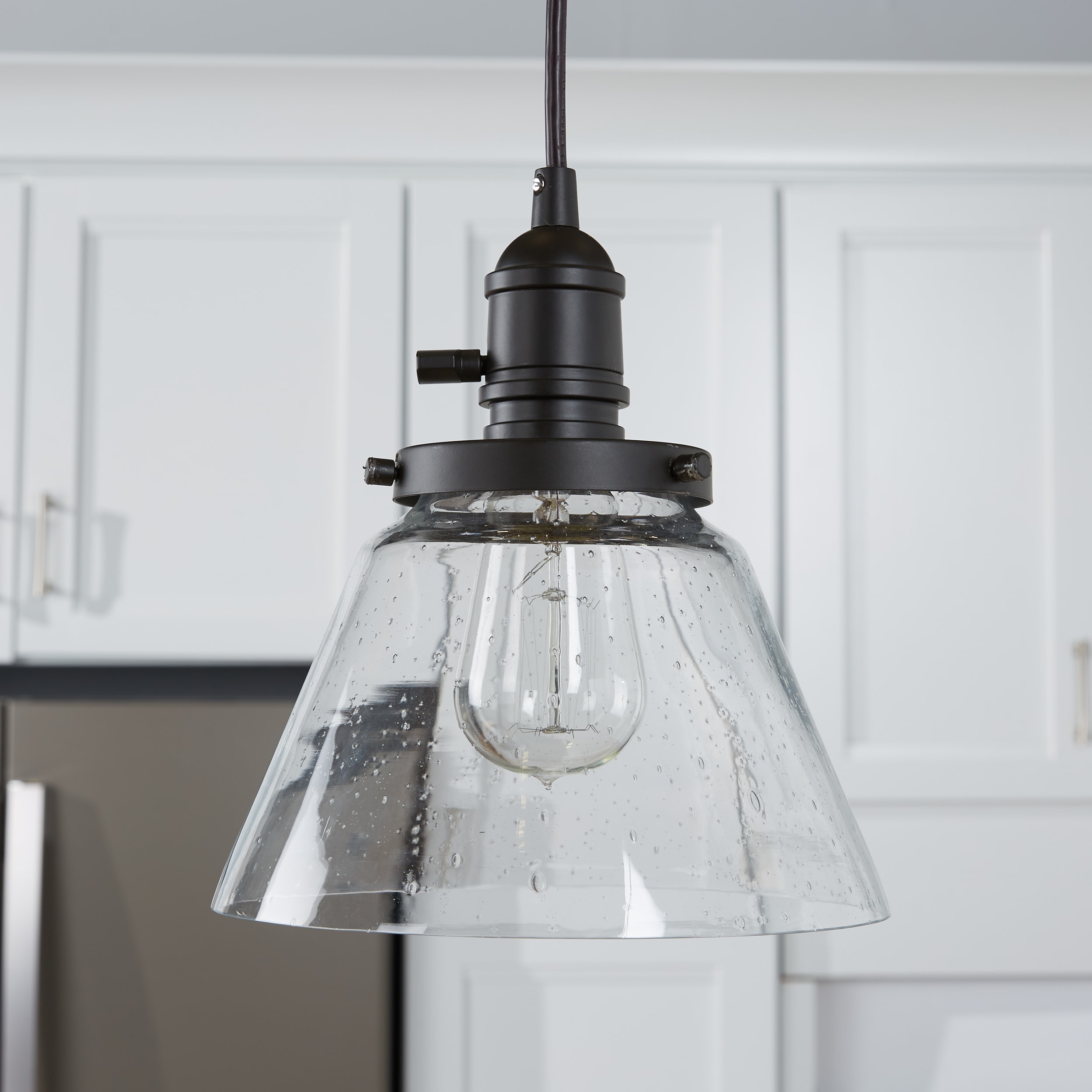 Avery Distressed Bronze 8.75" Mini Pendant with Clear Seeded Glass