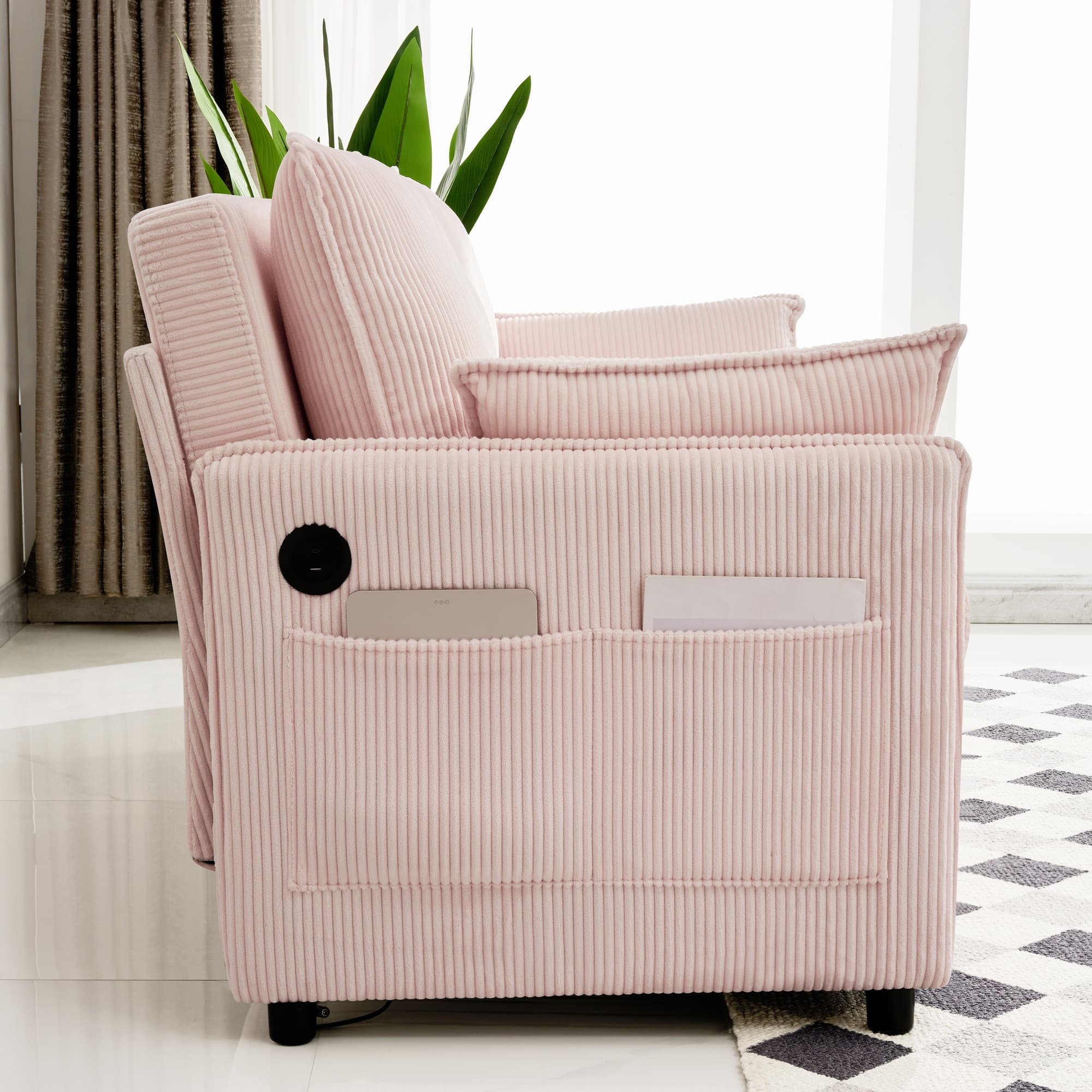 Side view of pink corduroy sofa with side pocket and electronics access