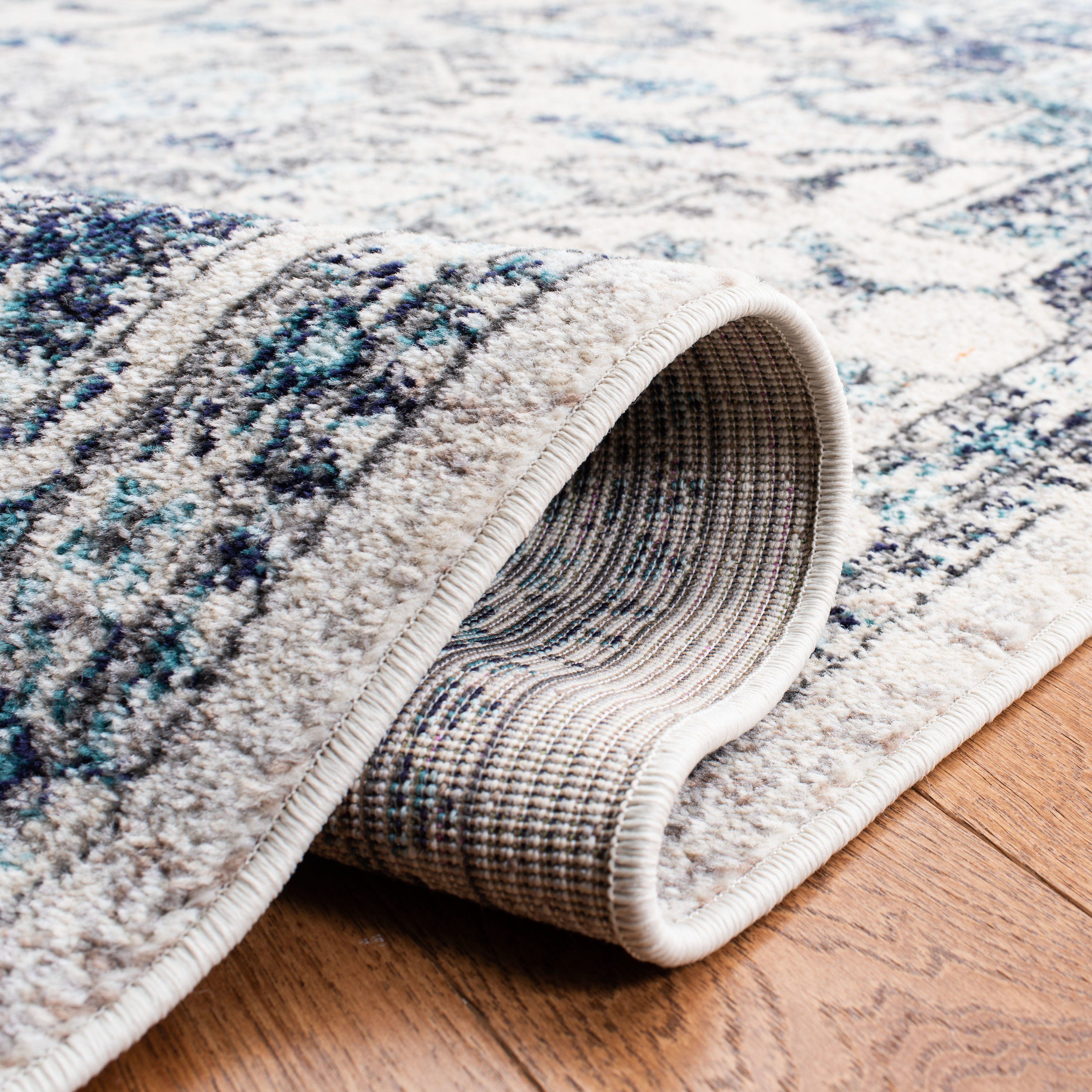 Ivory and Grey Synthetic 6' x 9' Distressed Medallion Area Rug