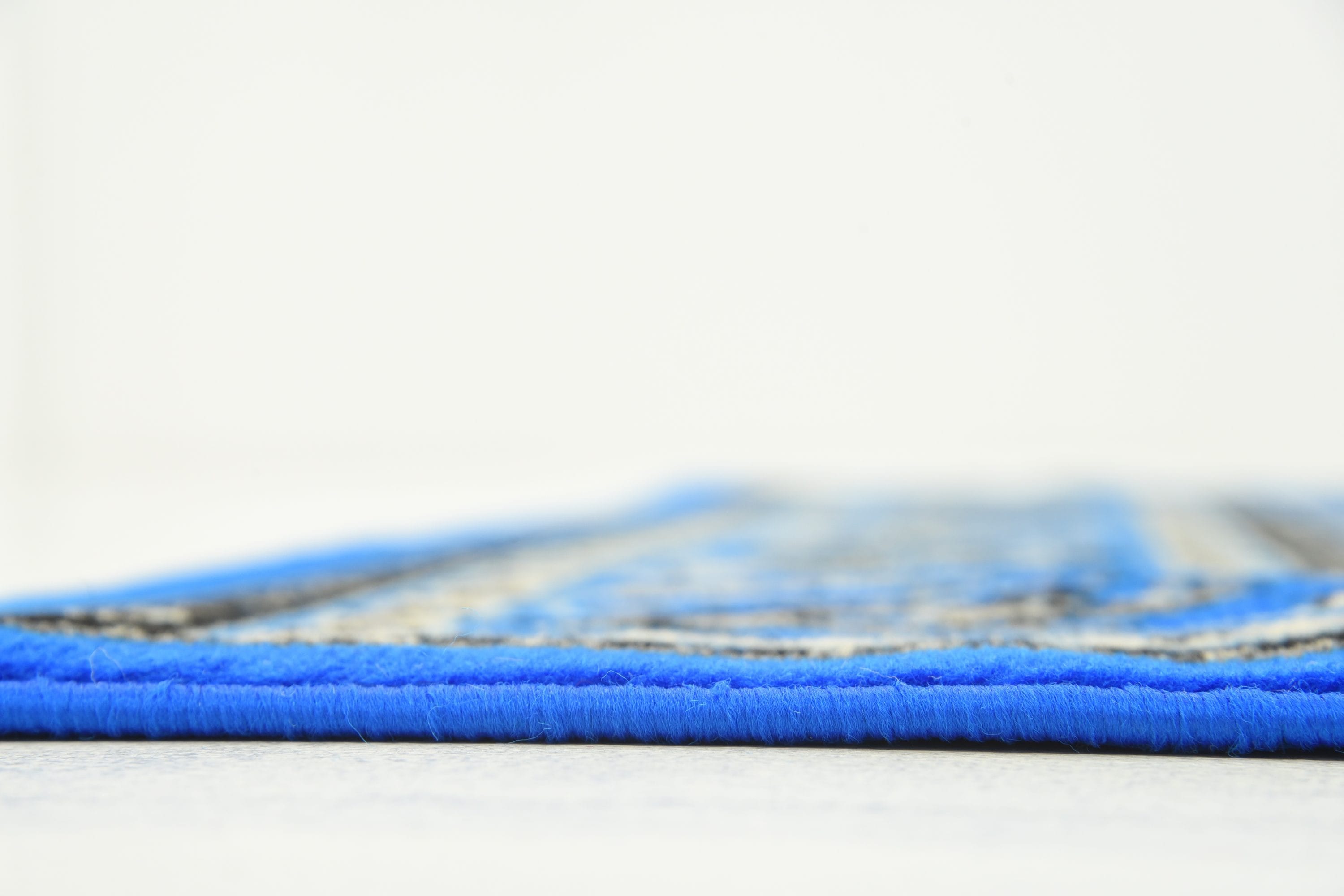 Blue and Ivory Synthetic Washable Reversible Area Rug
