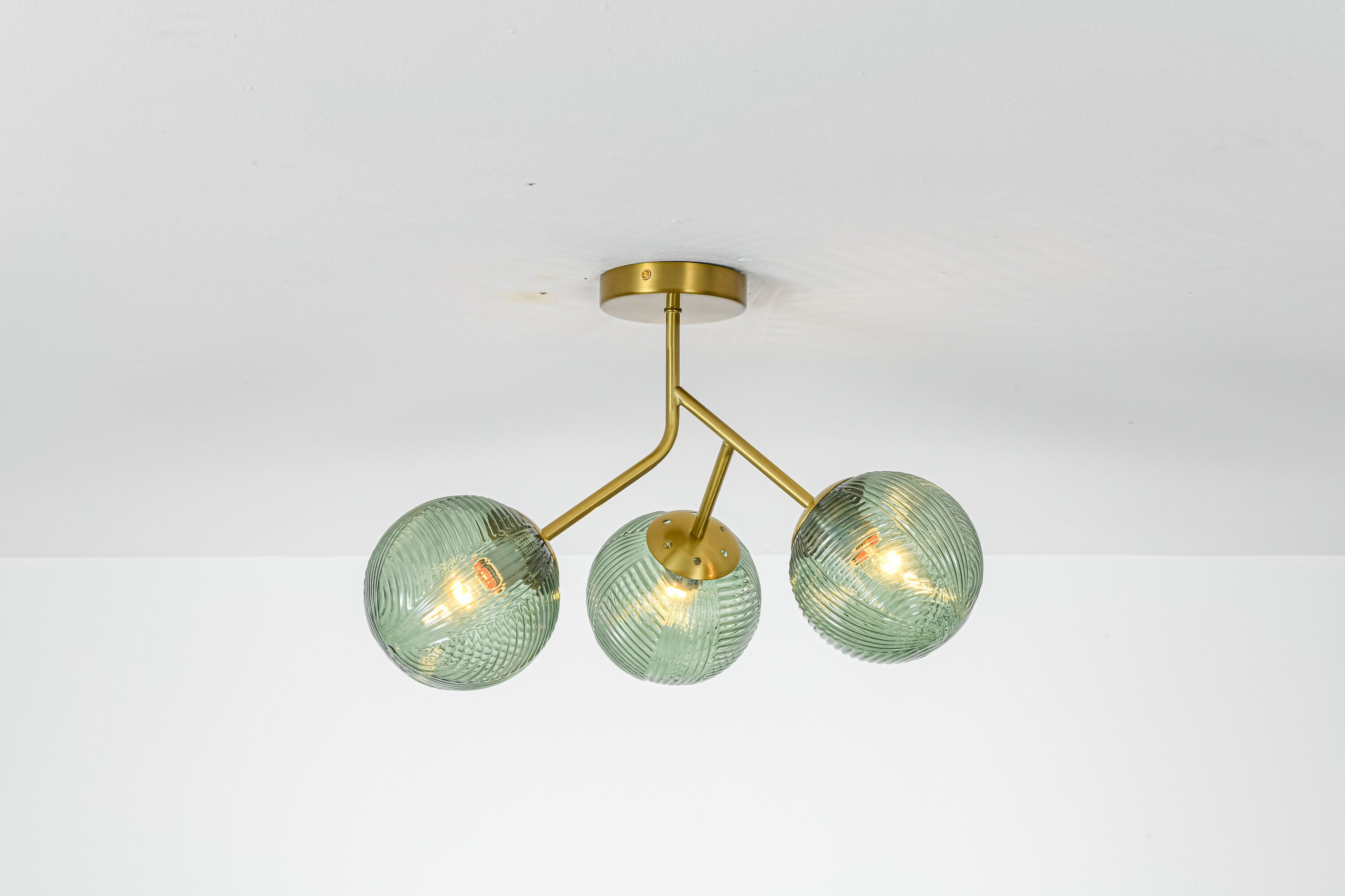 Rennnsan Zorevia 3-Light Mid-Century Brass Flush Mount Ceiling Light with Green Ribbed Glass Globe Shades