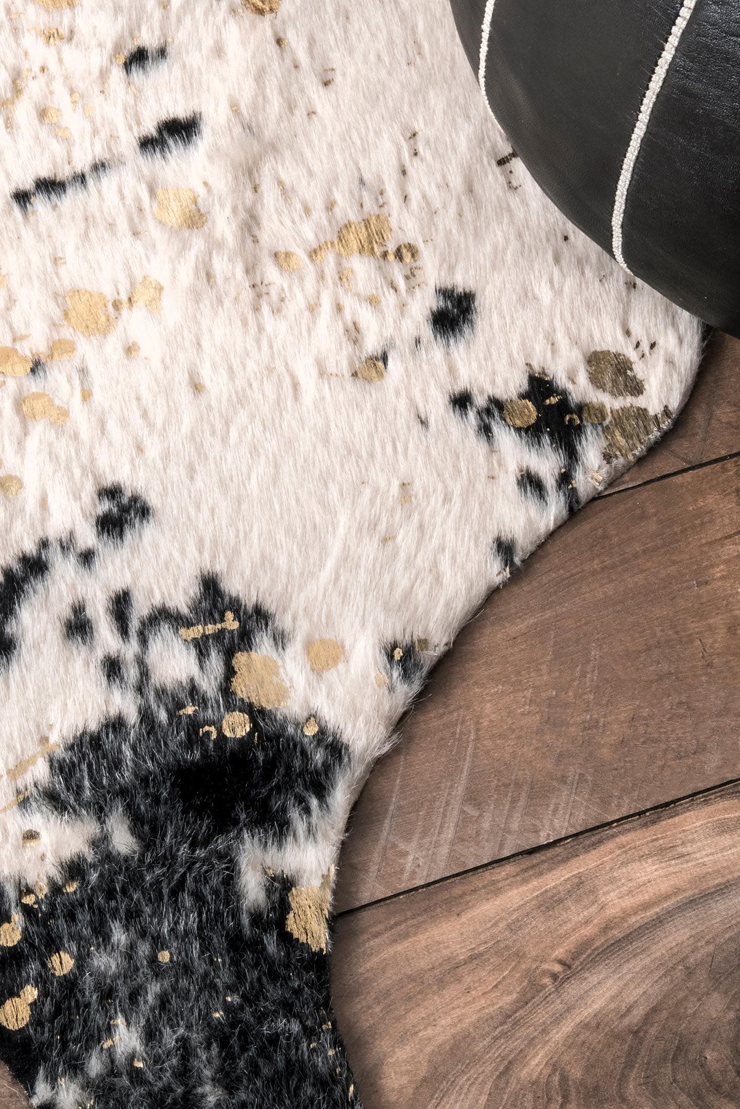 Black and Ivory Tufted Synthetic Cowhide Shaped Area Rug