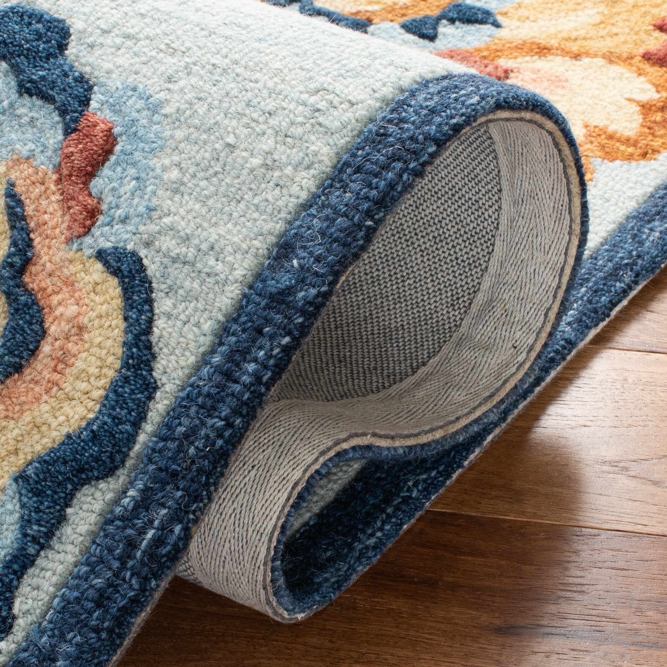Handmade Blue Floral Wool 4' x 6' Area Rug