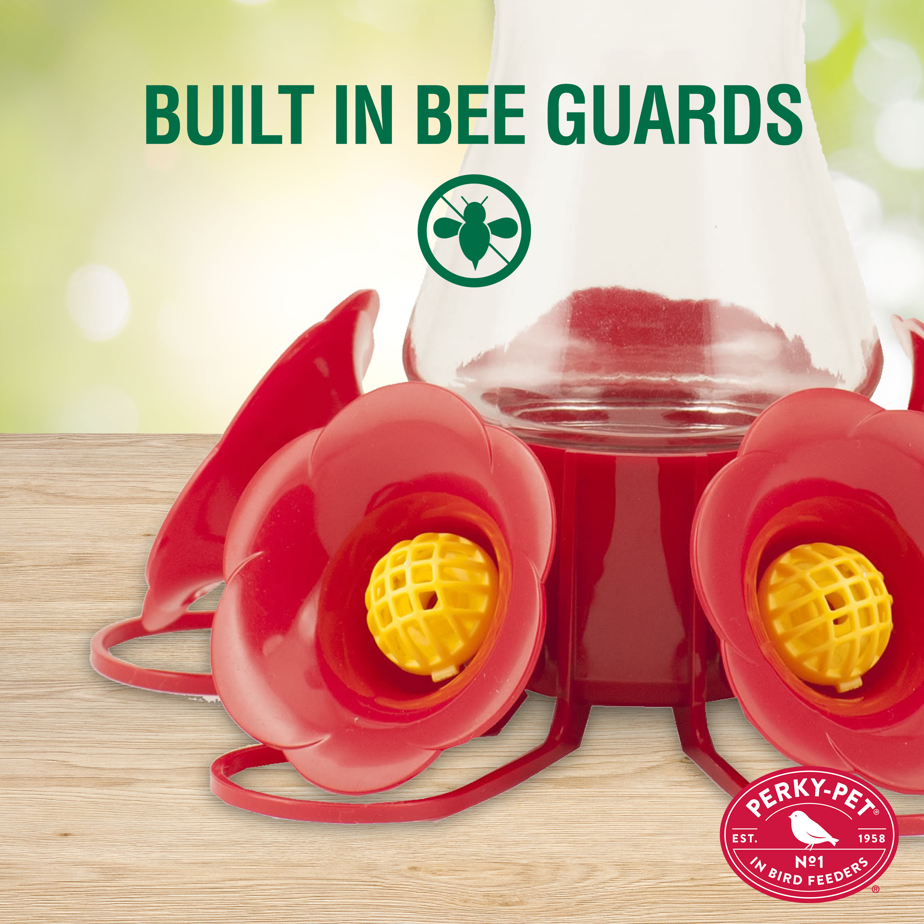 Perky pet bee clearance guards for hummingbird feeders