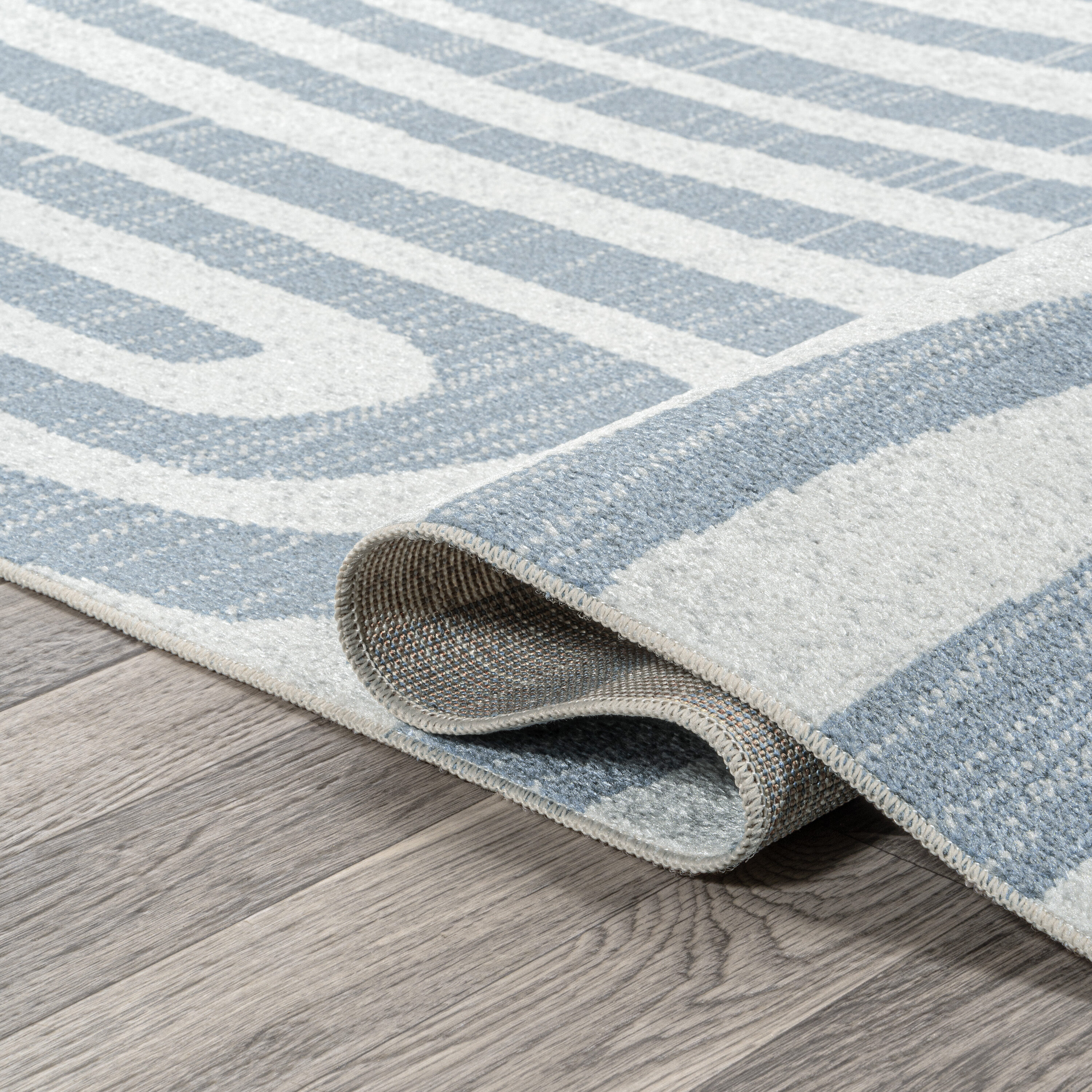 Blue and Cream Abstract Synthetic 4' x 6' Washable Area Rug