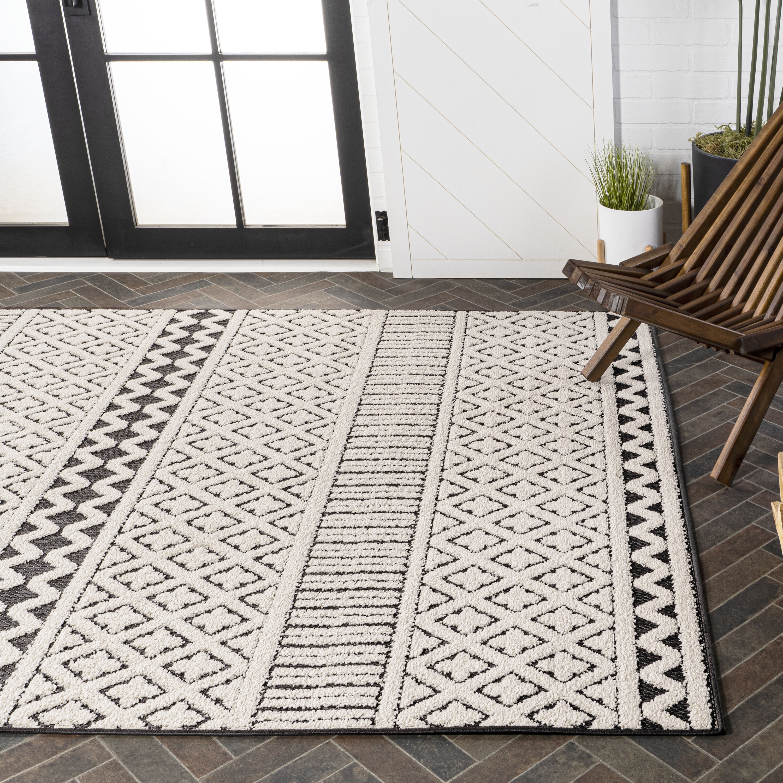 Cream and Black Geometric Synthetic Indoor/Outdoor Area Rug