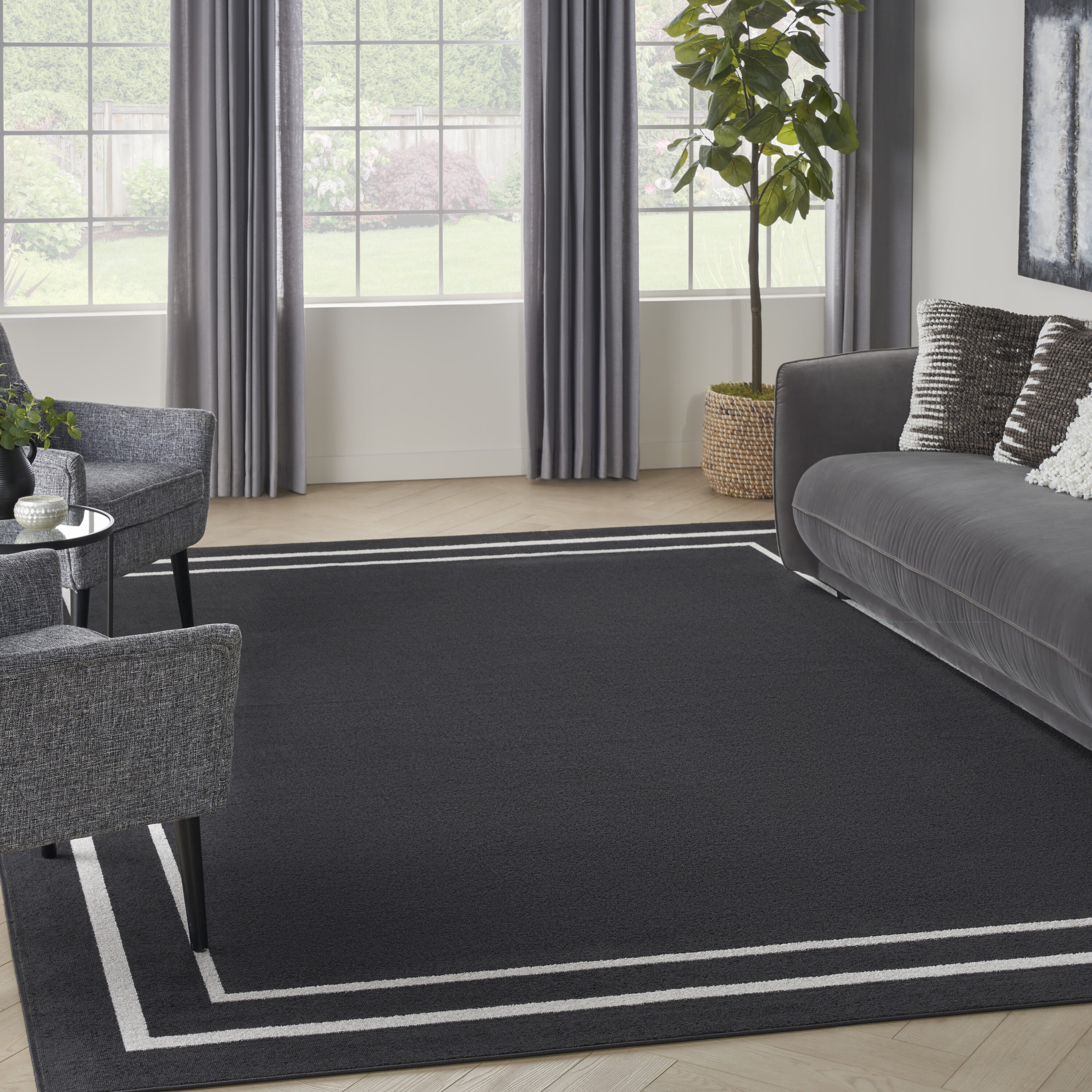 Nourison Home 099446934758 Essentials 7 x 10 (ft) Loomed Polypropylene Black Ivory Rectangular Indoor/Outdoor Solid Area rug