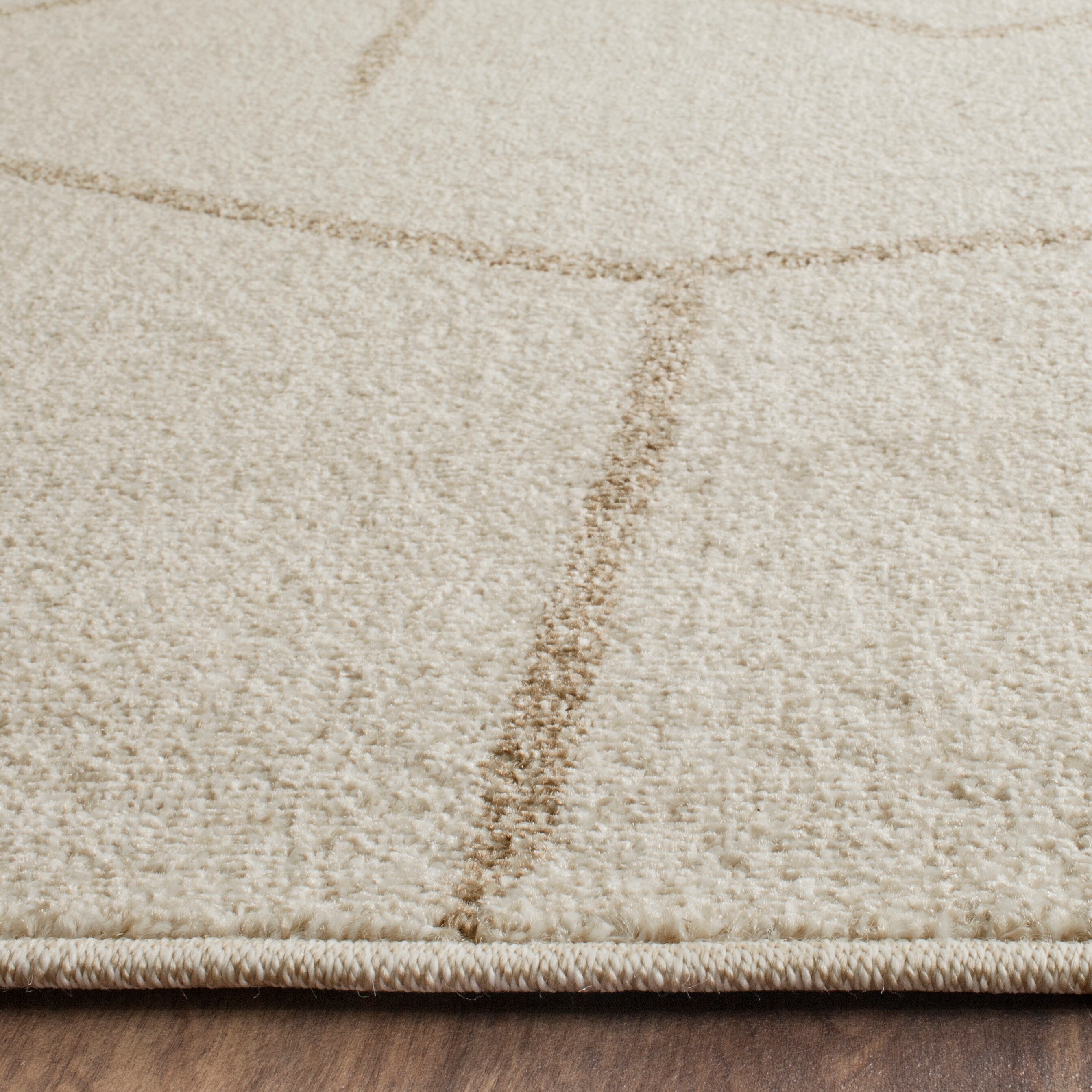 Ivory Geometric Easy-Care 8' x 10' Synthetic Area Rug