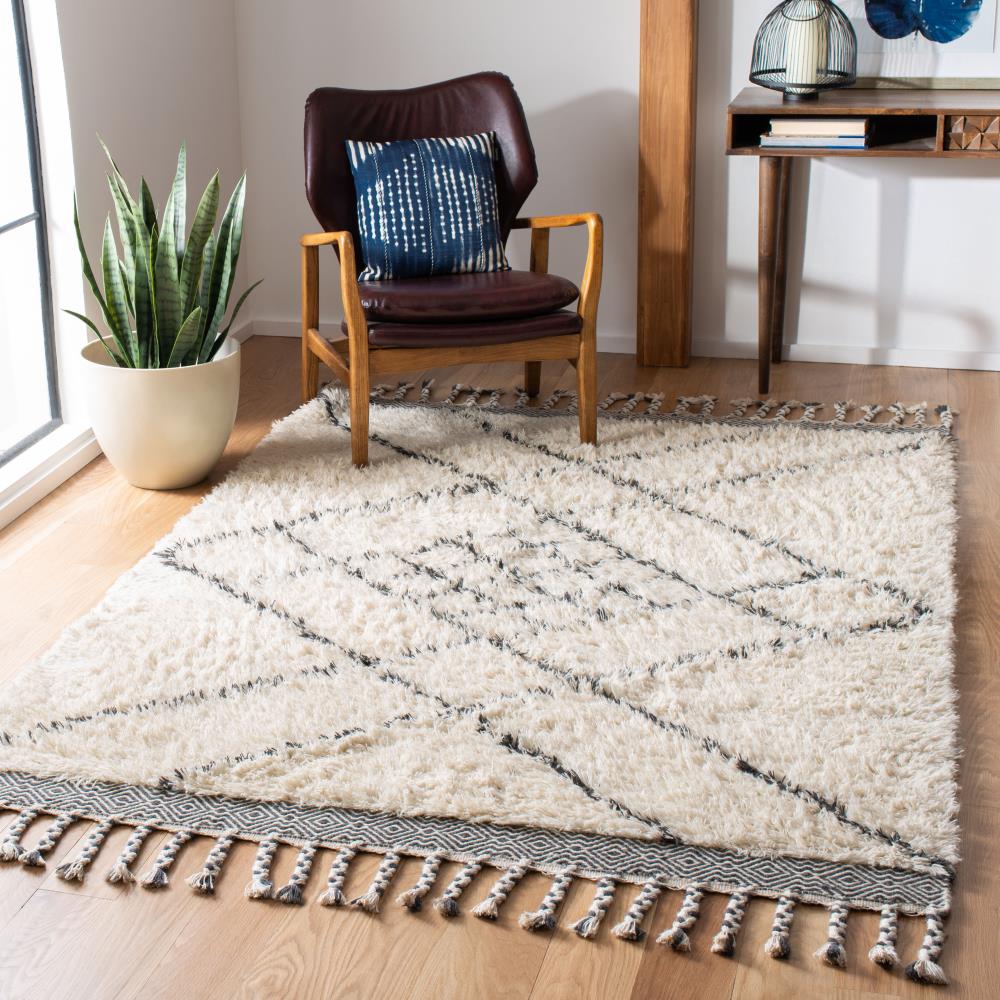 Handmade Ivory Wool Shag 5' x 8' Area Rug with Tasseled Ends