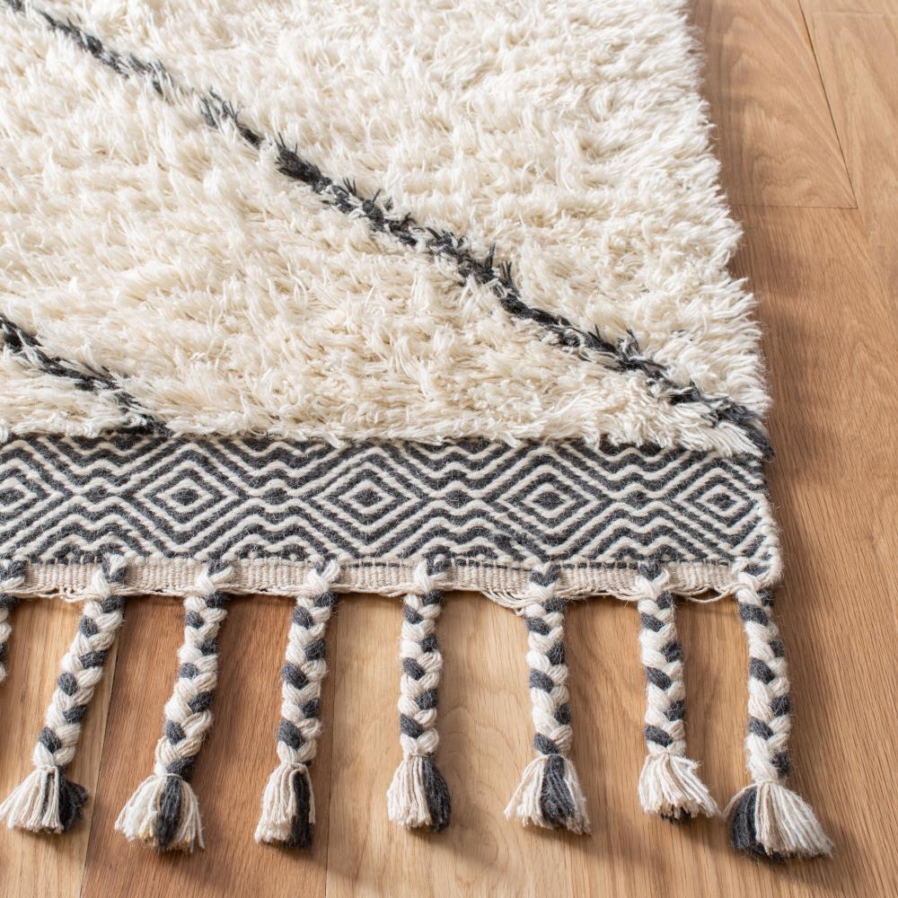Handmade Ivory Wool Shag 5' x 8' Area Rug with Tasseled Ends