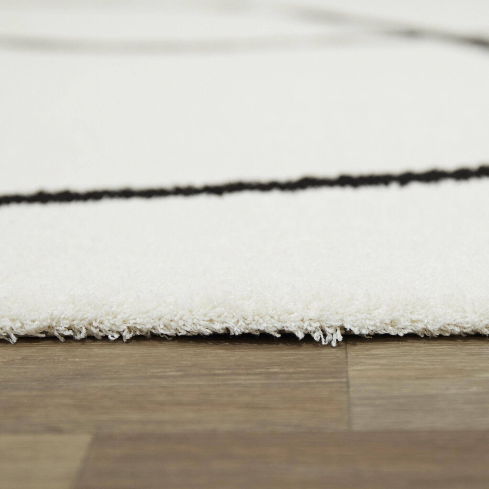 White and Black Abstract Polyester Rectangular Rug 5' x 7'