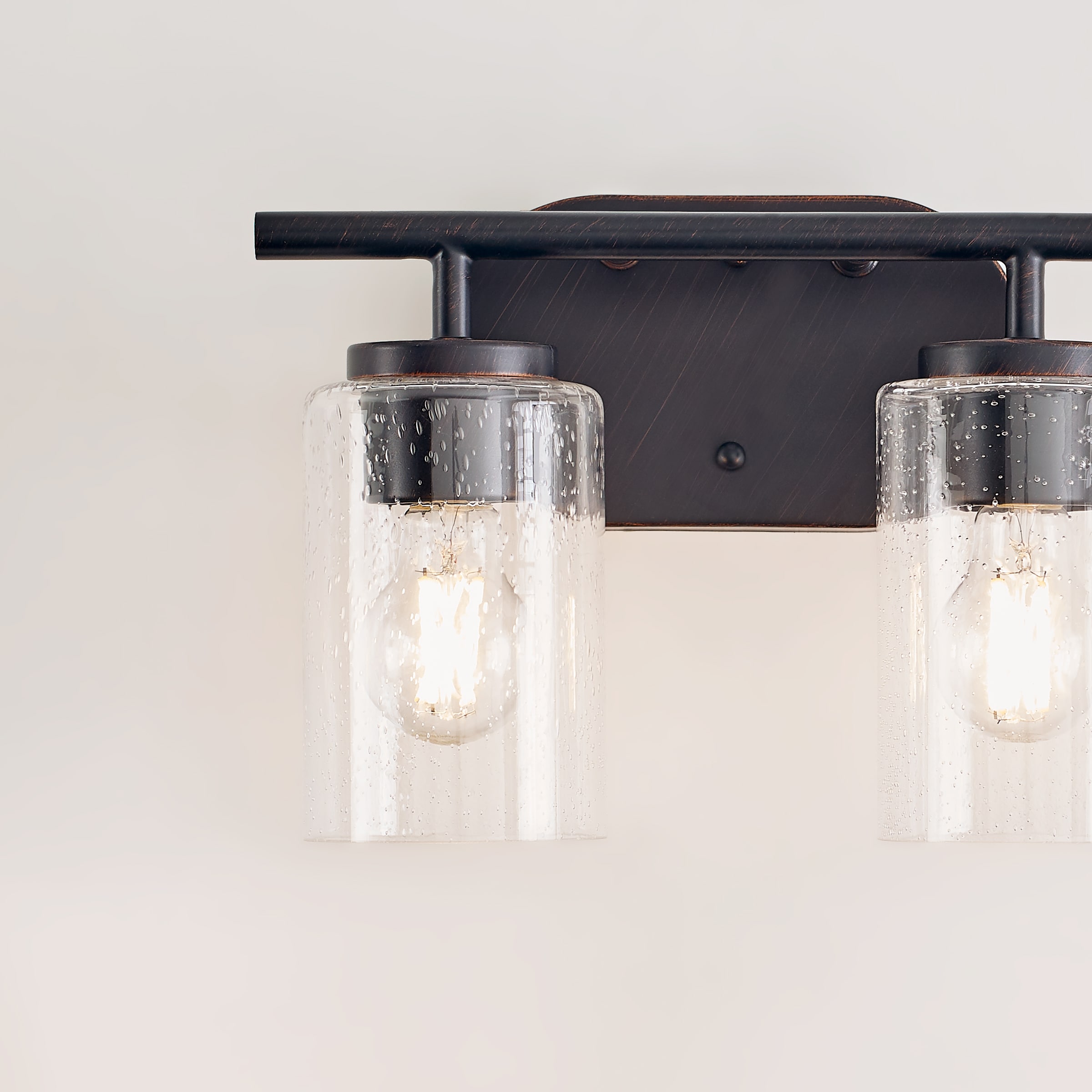 Oslo Bronze 2-Light Vanity Fixture with Clear Seeded Glass