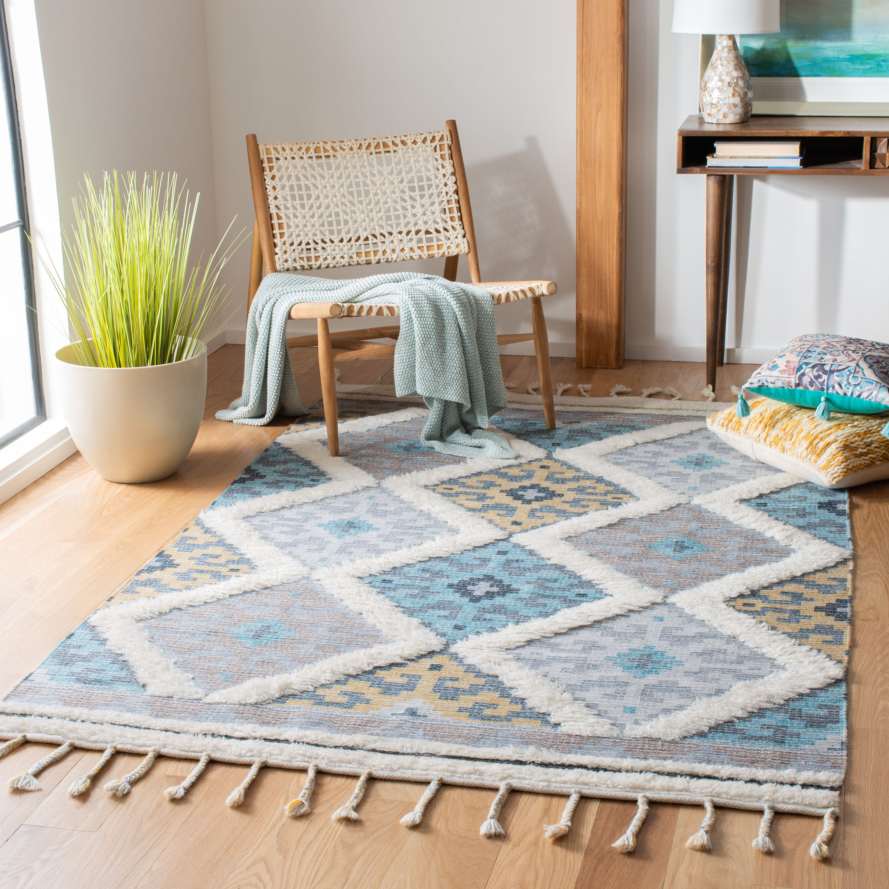 5 x 8 (ft) Loomed Wool Ivory / Turquoise Rectangular Indoor Geometric Bohemian/Eclectic Professionally Clean Only Area rug