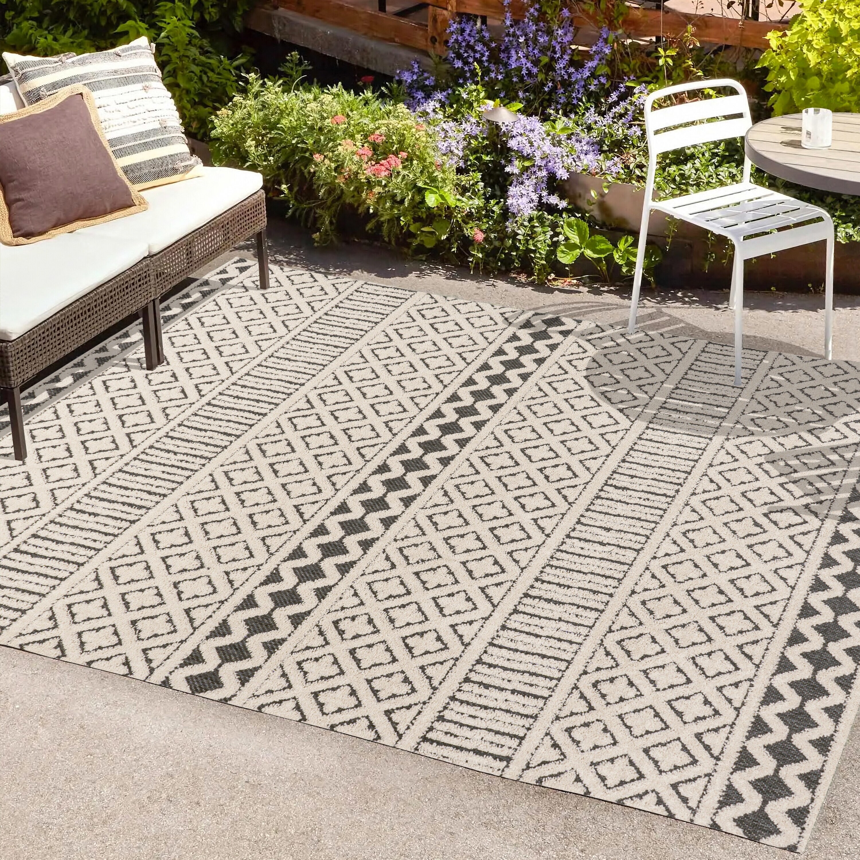 Cream and Black Geometric Synthetic Indoor/Outdoor Area Rug