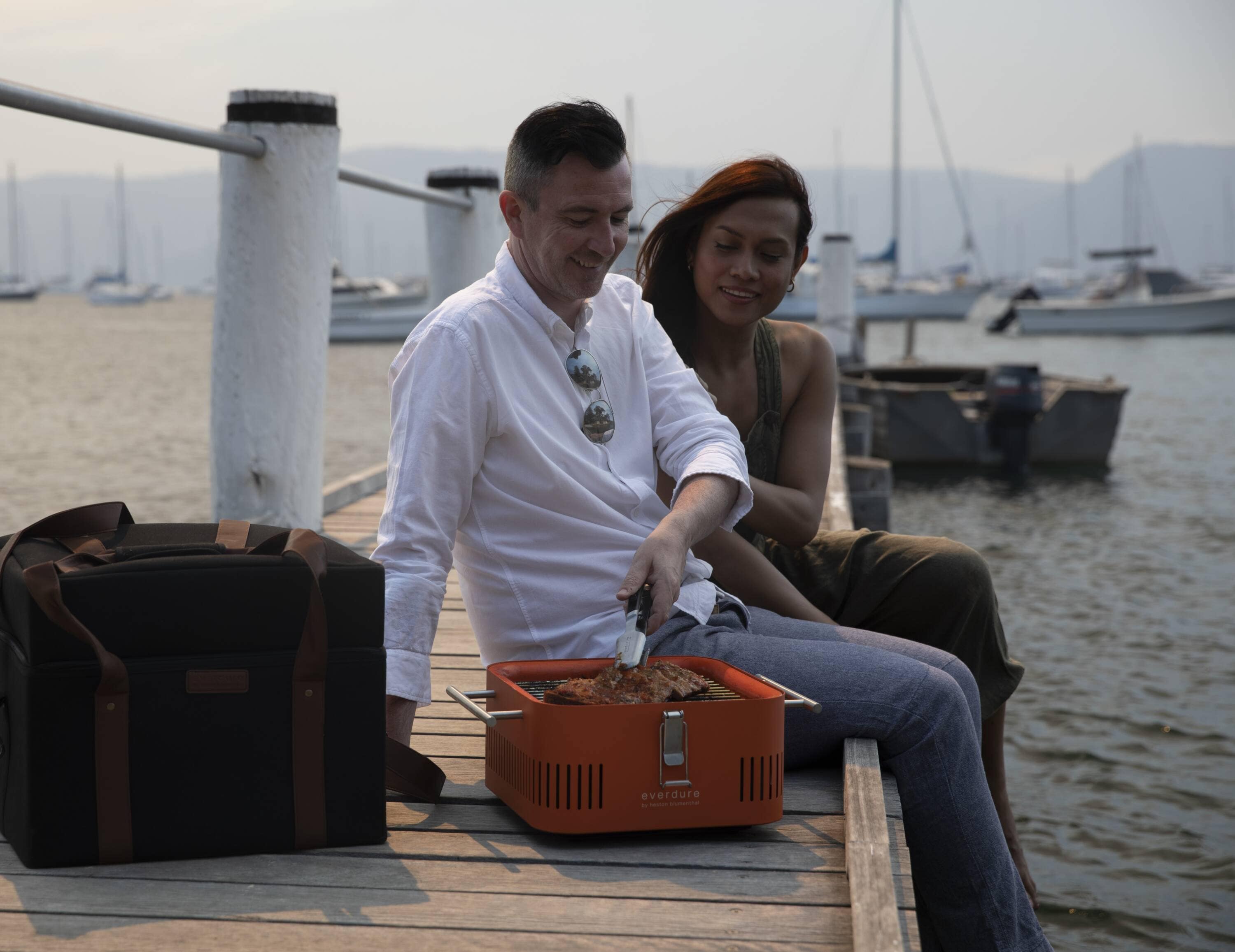 Everdure Orange Portable Charcoal Grill with Bamboo Board