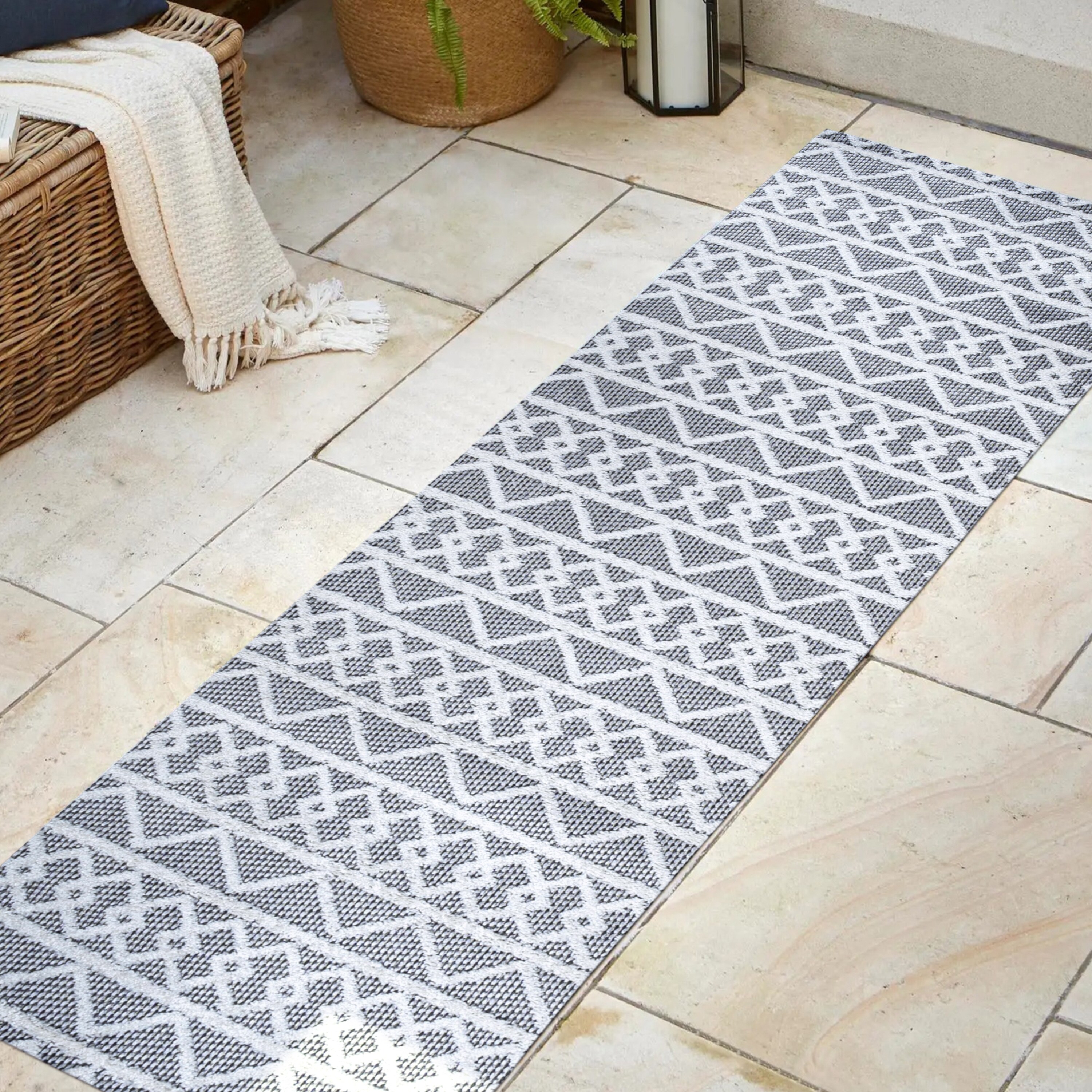Aylan Black/Ivory Geometric High-Low Pile Synthetic Indoor/Outdoor Rug
