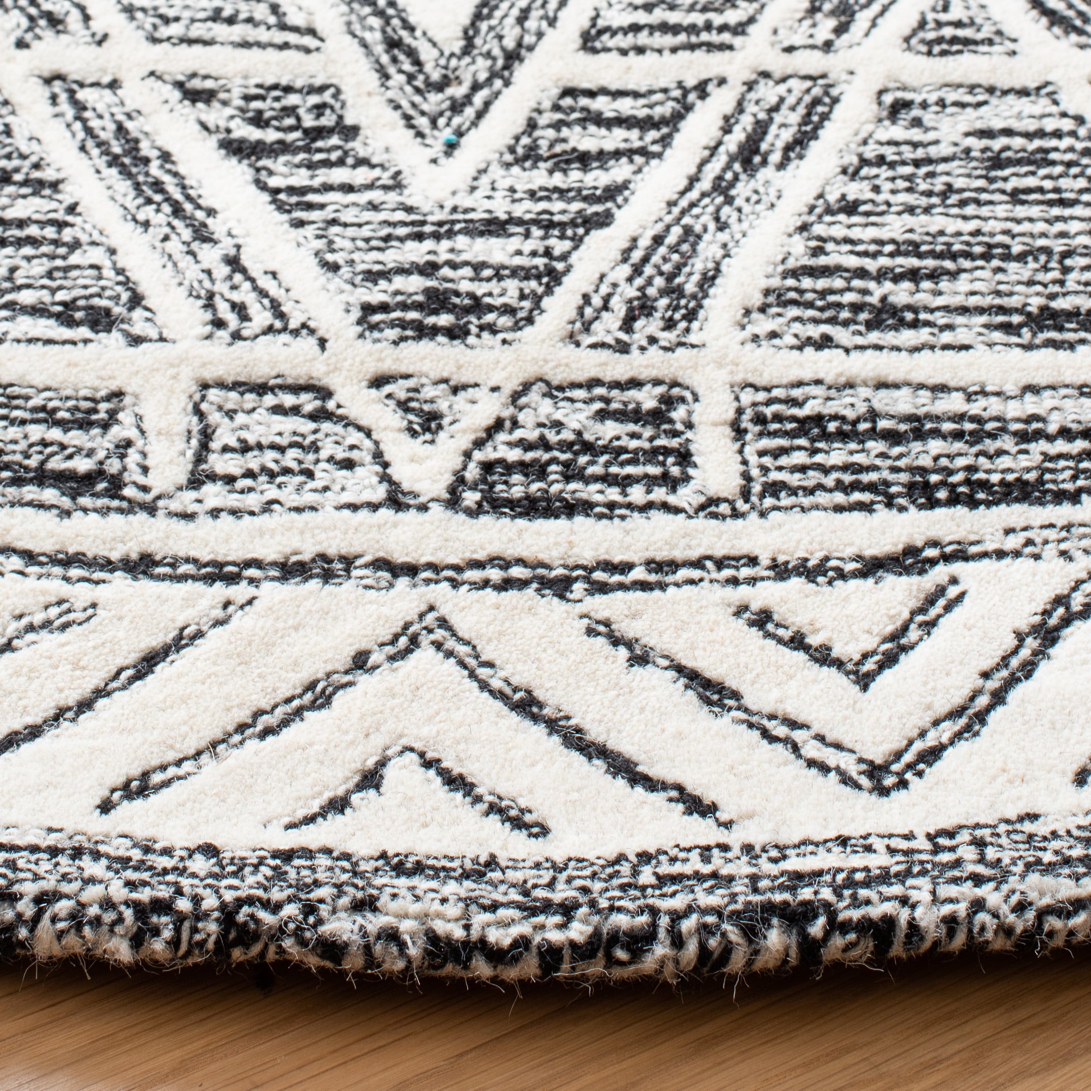 Handmade Abstract Black and Ivory Wool Round Rug 6'
