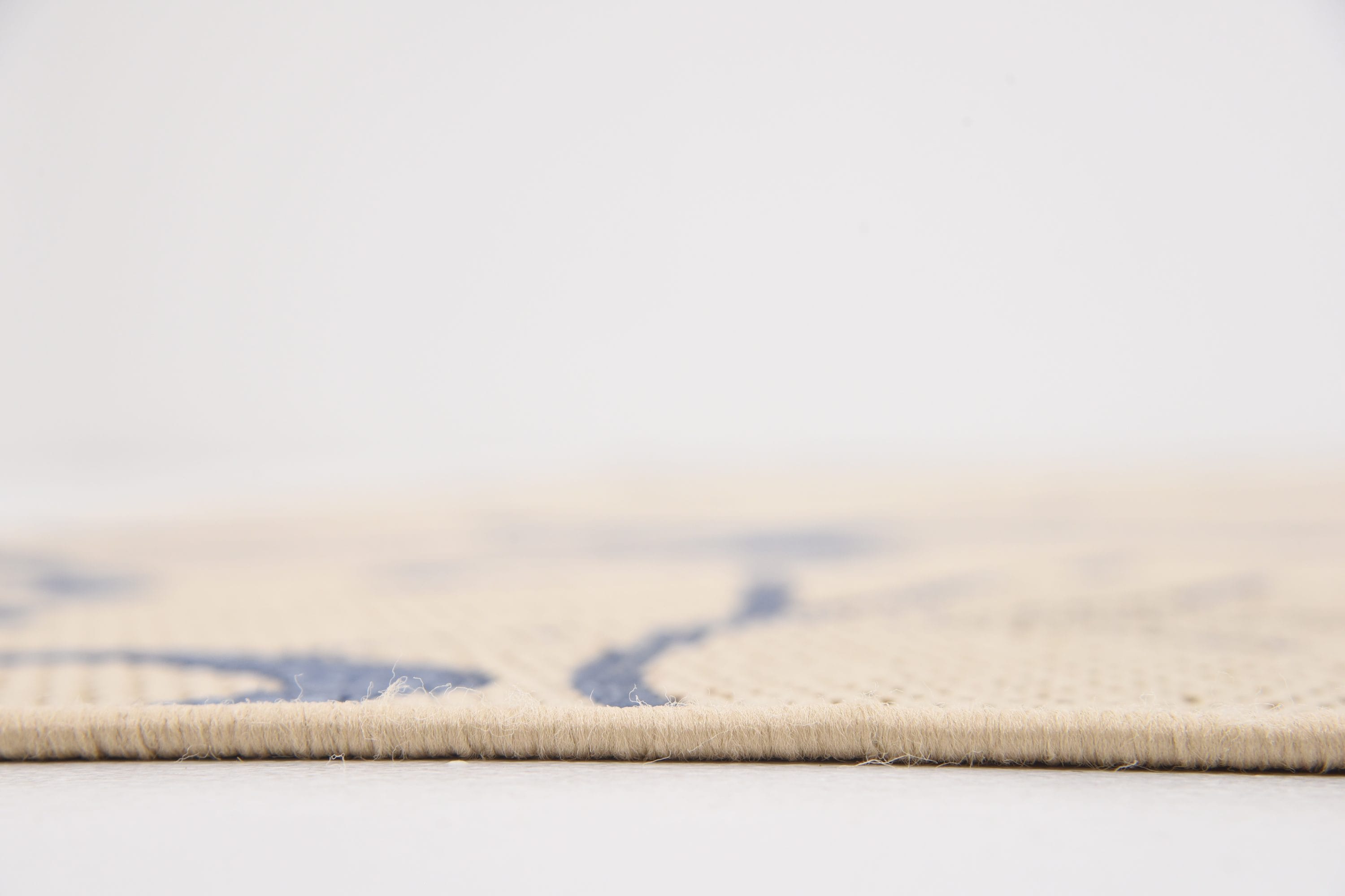 Beige and Navy Blue 9' x 12' Abstract Outdoor Rug