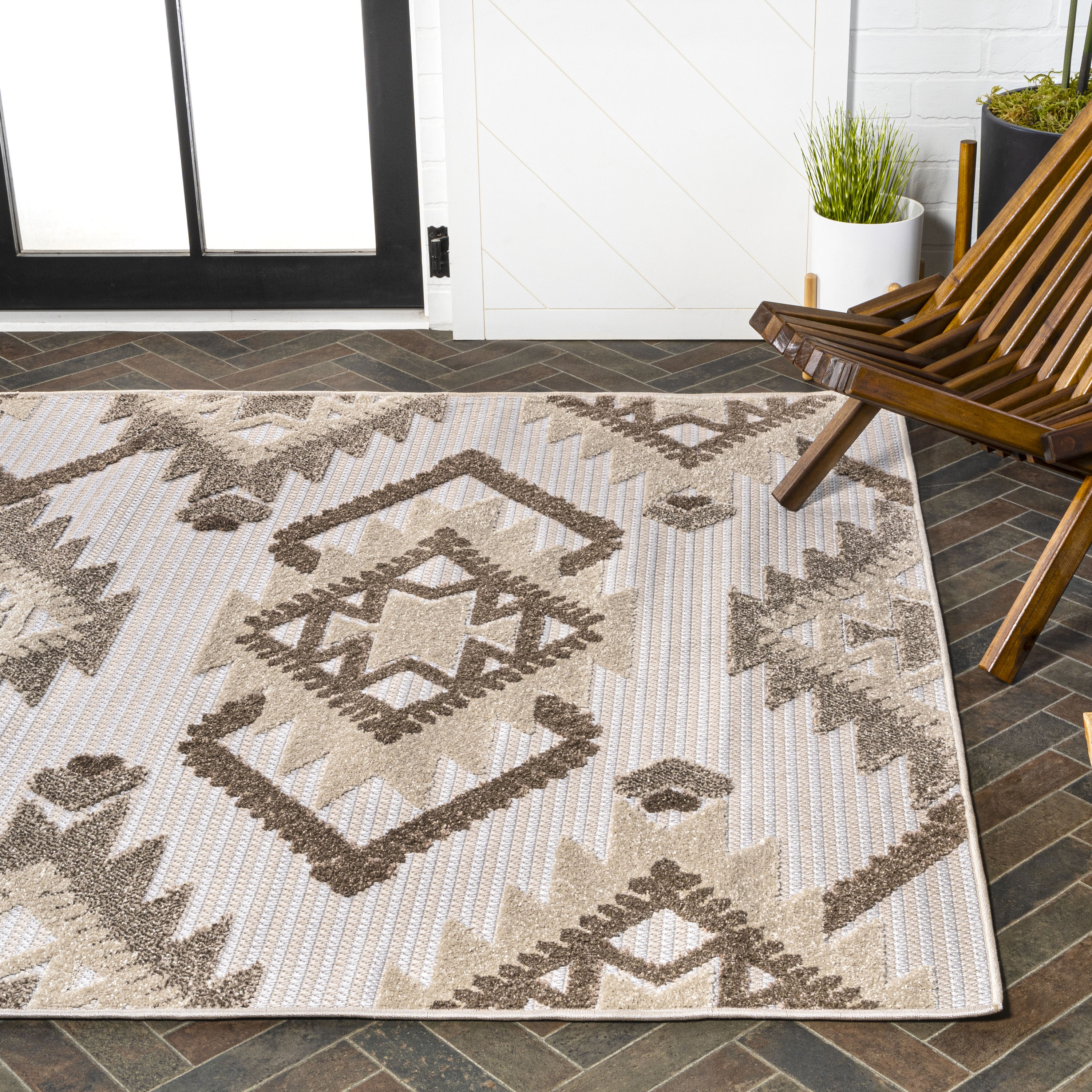Ivory and Brown Geometric Synthetic 4' x 6' Indoor/Outdoor Rug